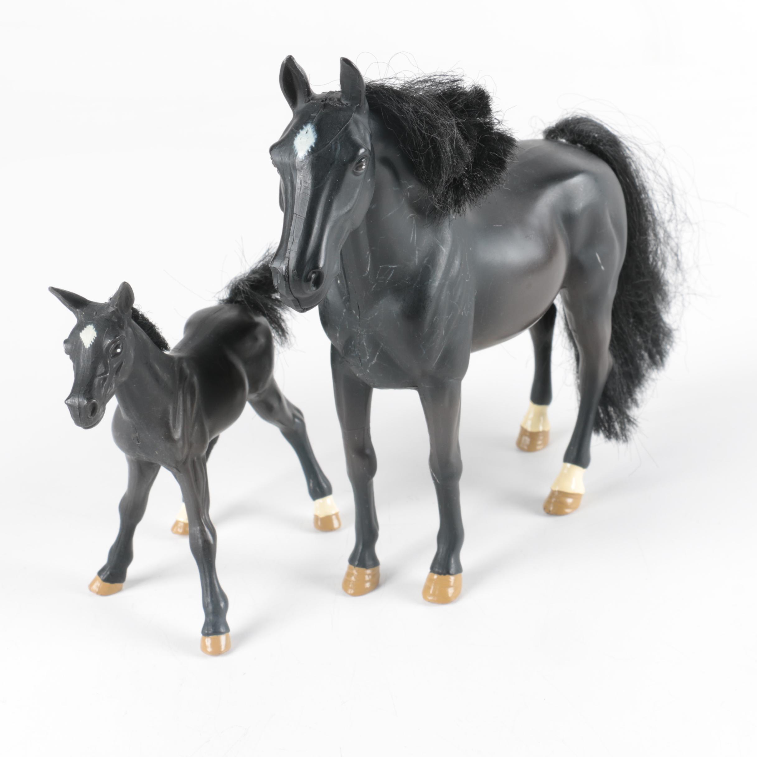 Nine Plastic Toy Horse Figures