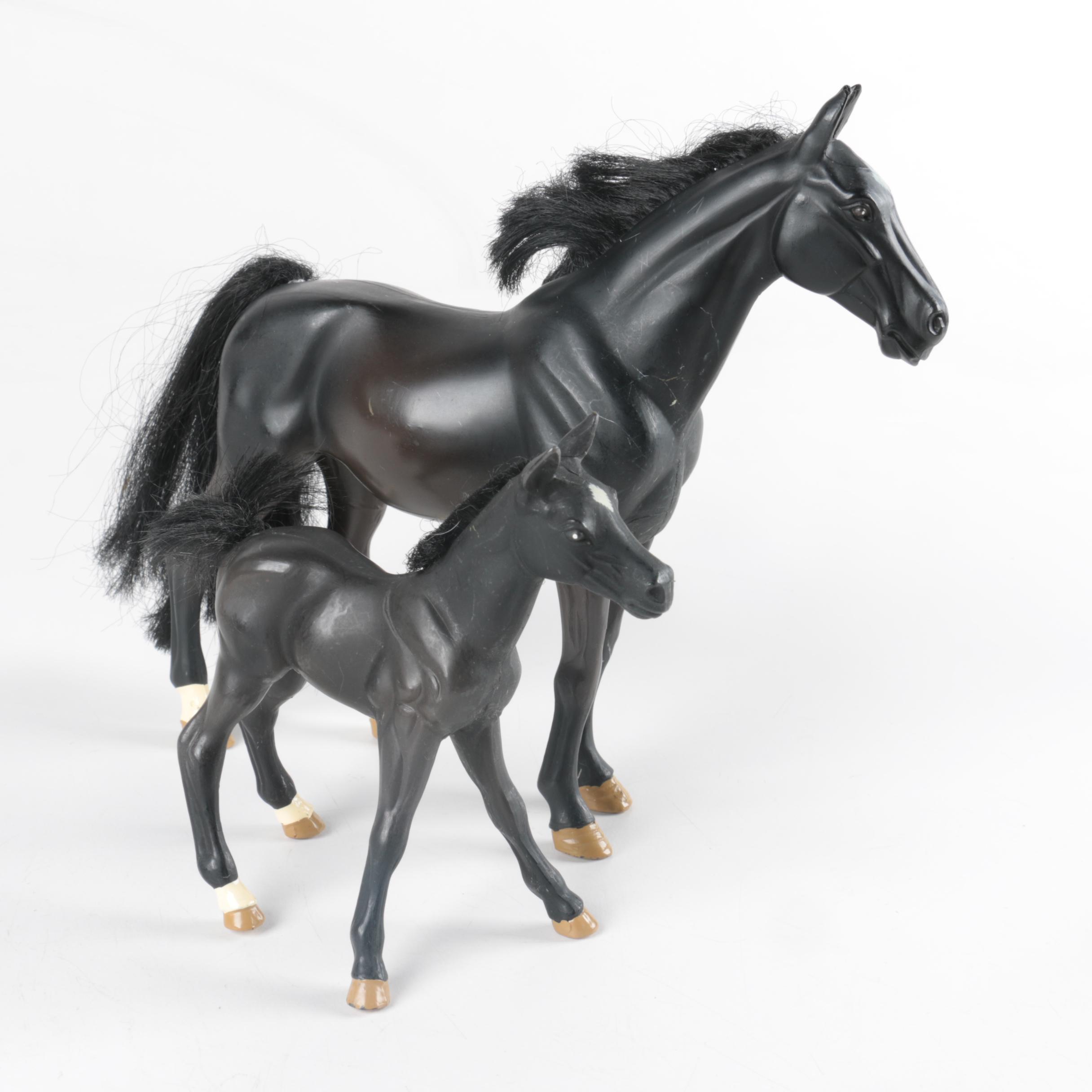 Nine Plastic Toy Horse Figures
