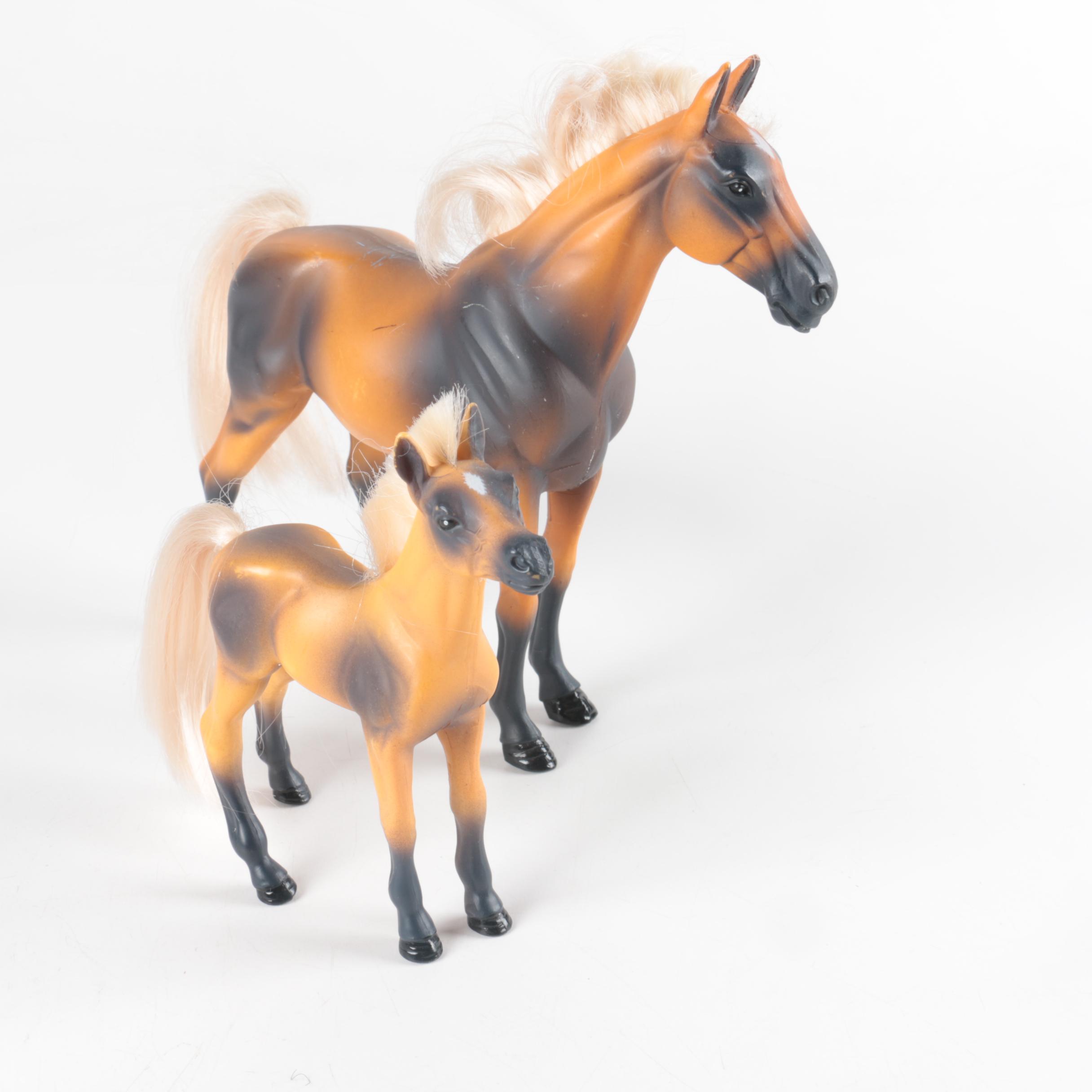Nine Plastic Toy Horse Figures