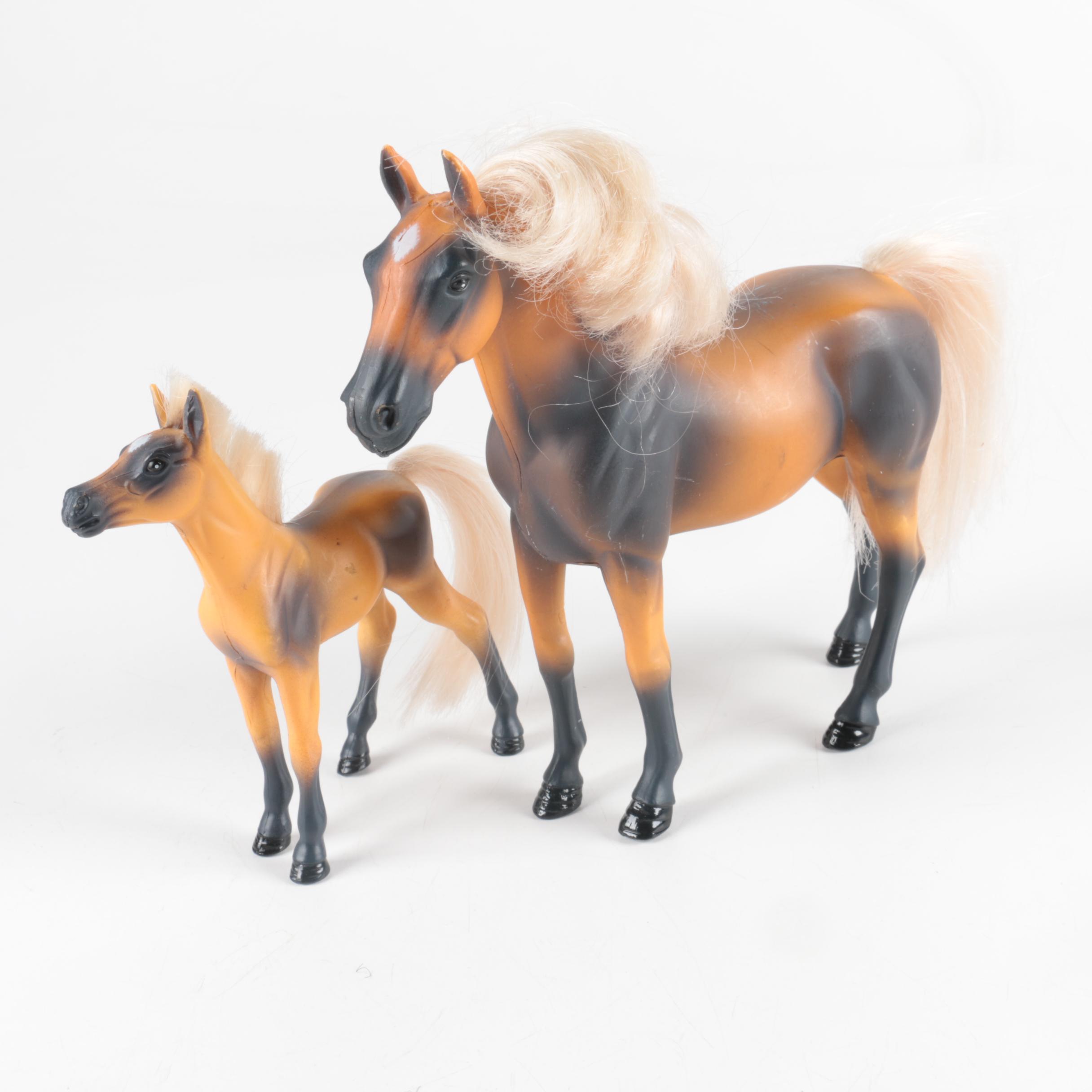 Nine Plastic Toy Horse Figures