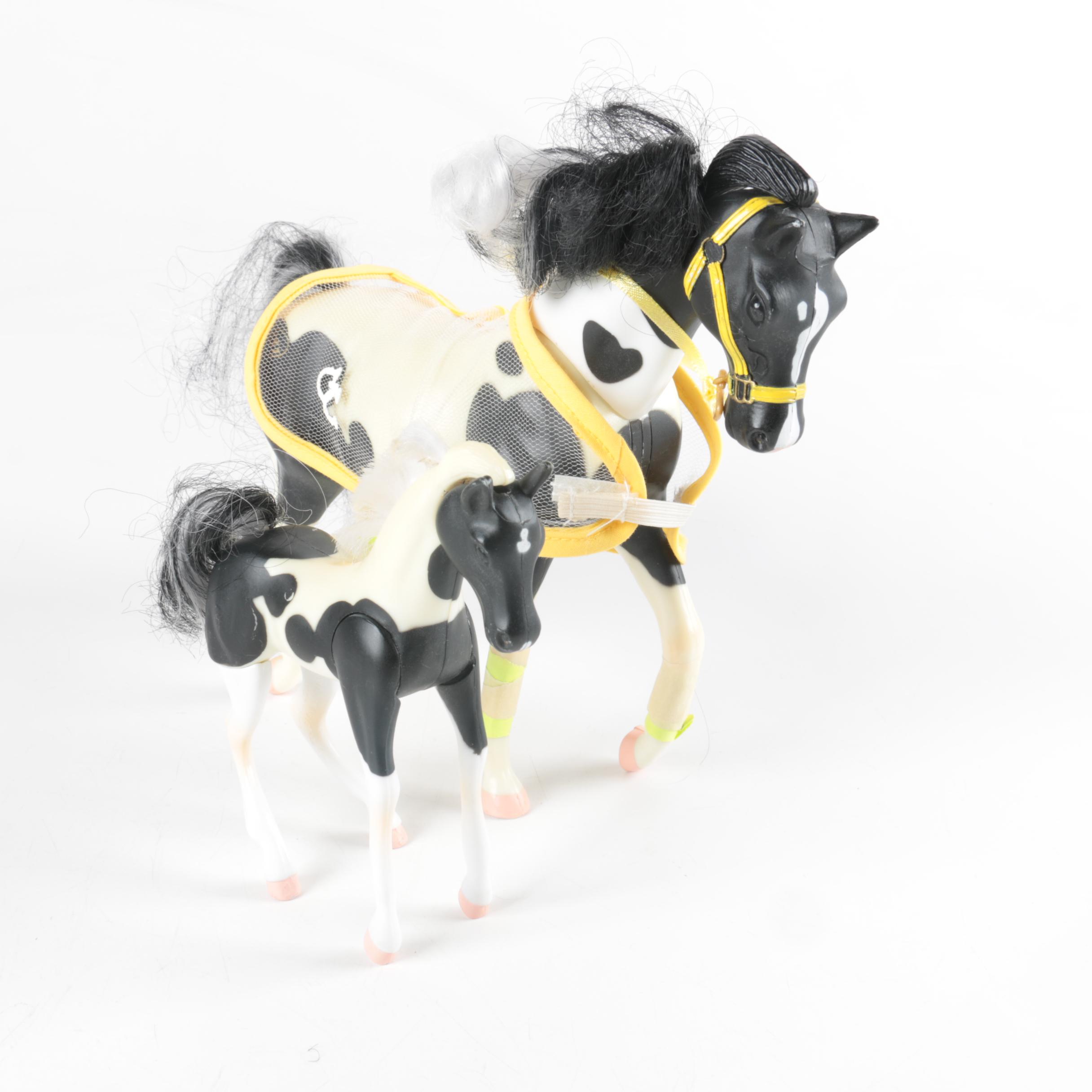Nine Plastic Toy Horse Figures