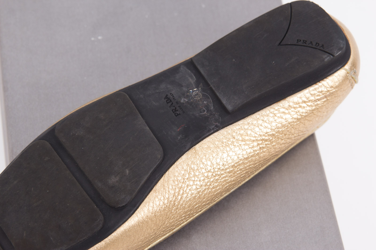 Prada Metallic Gold Tone Loafers