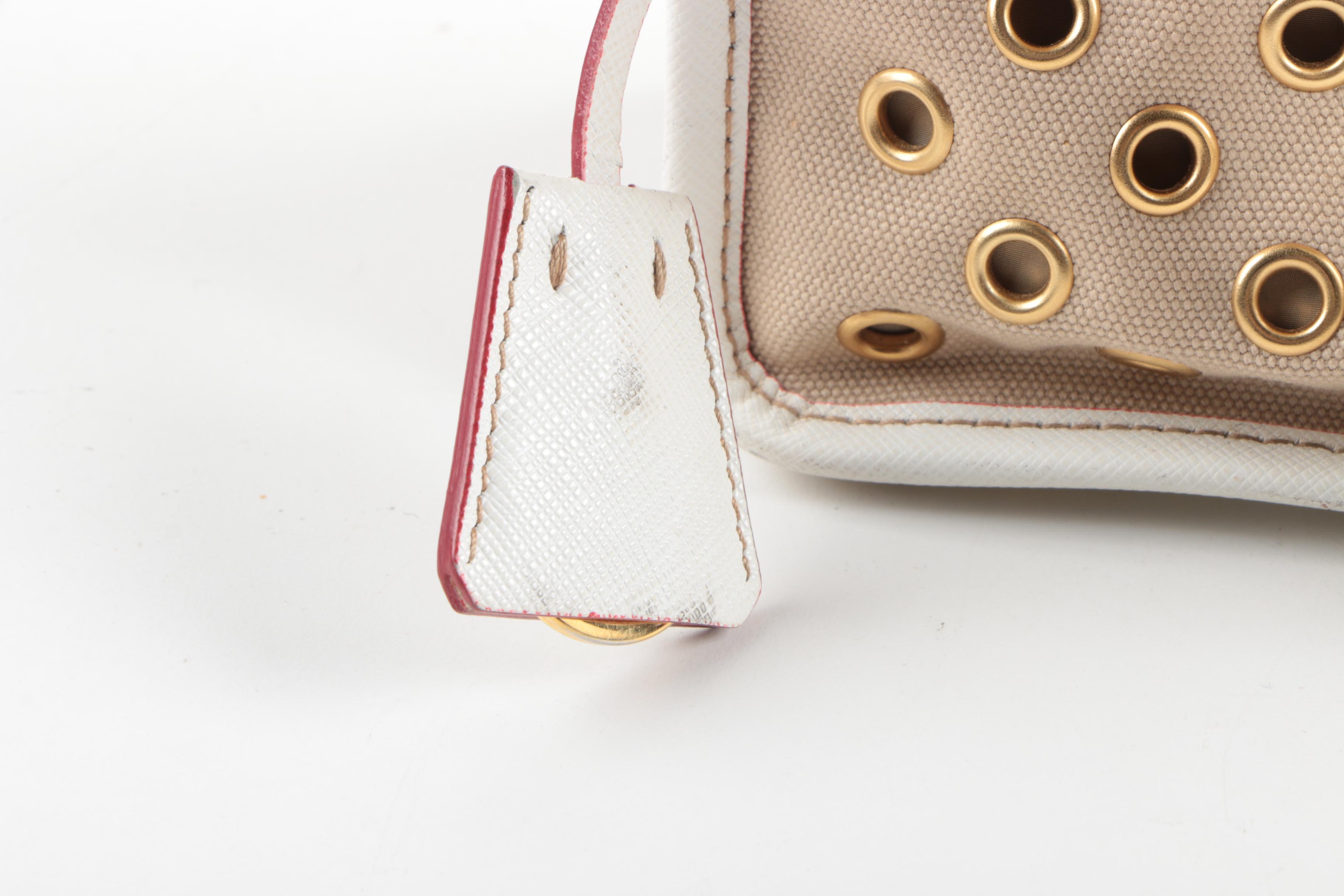 Prada Canvas and Leather Grommet Accent Handbag