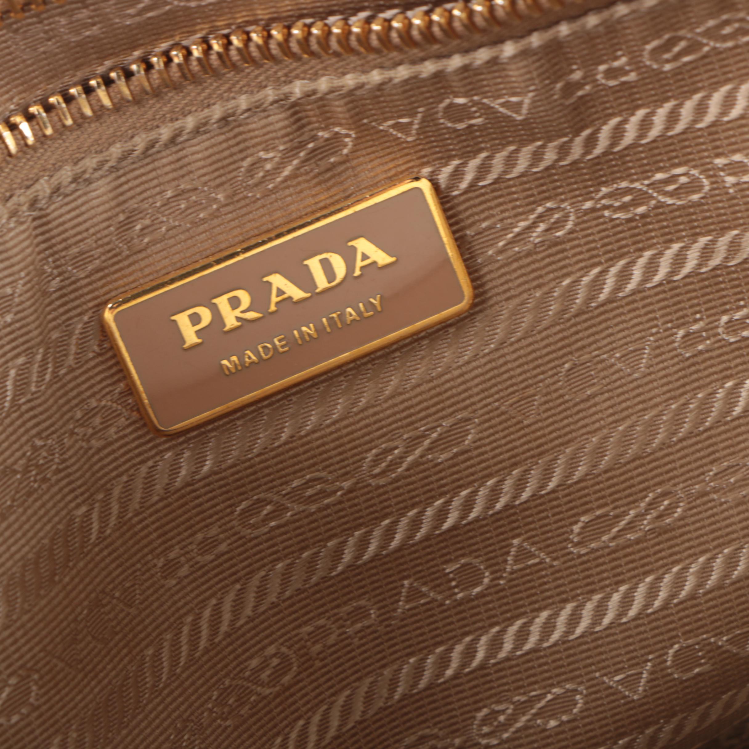 Prada Canvas and Leather Grommet Accent Handbag