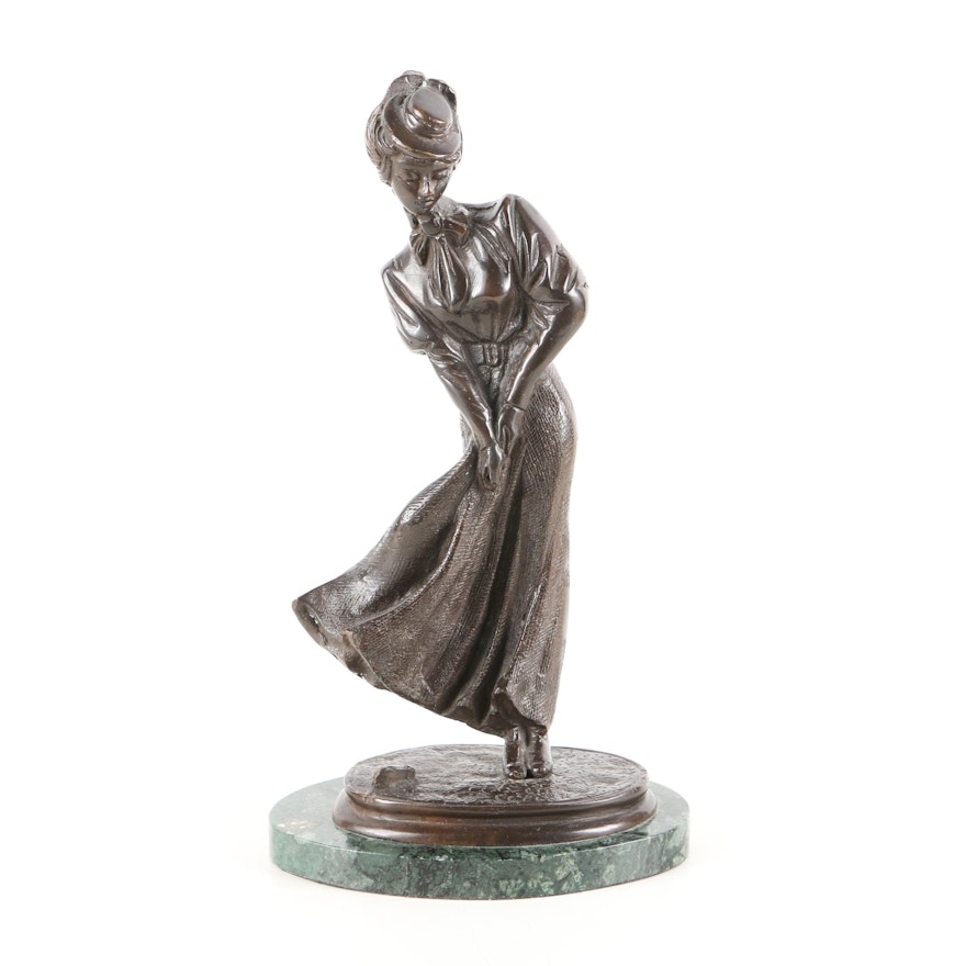 Cast Metal Sculpture of Woman Playing Golf