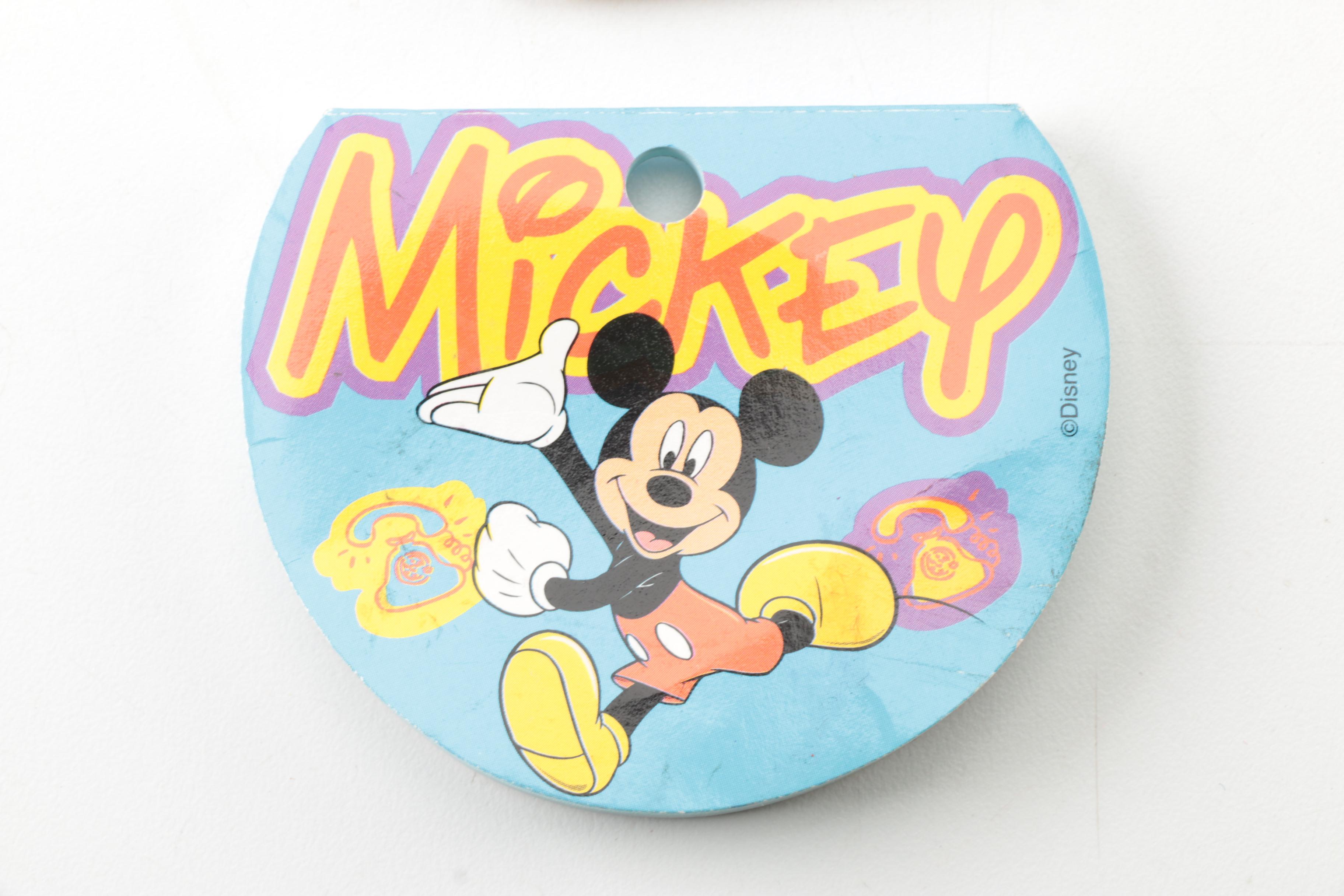 Disney Memorabilia Including Pens, Wall Clock, and More