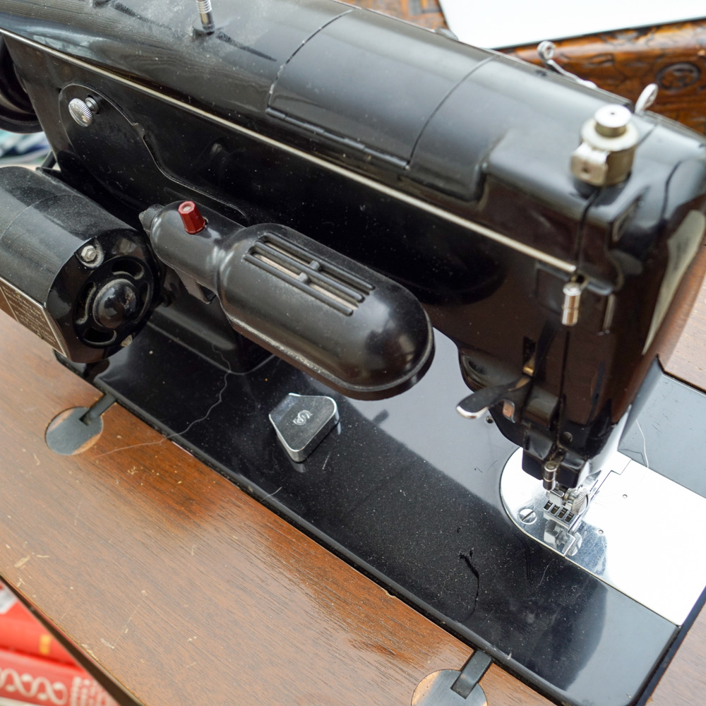 Vintage White Sewing Machine with Cabinet