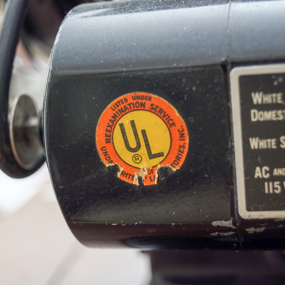 Vintage White Sewing Machine with Cabinet