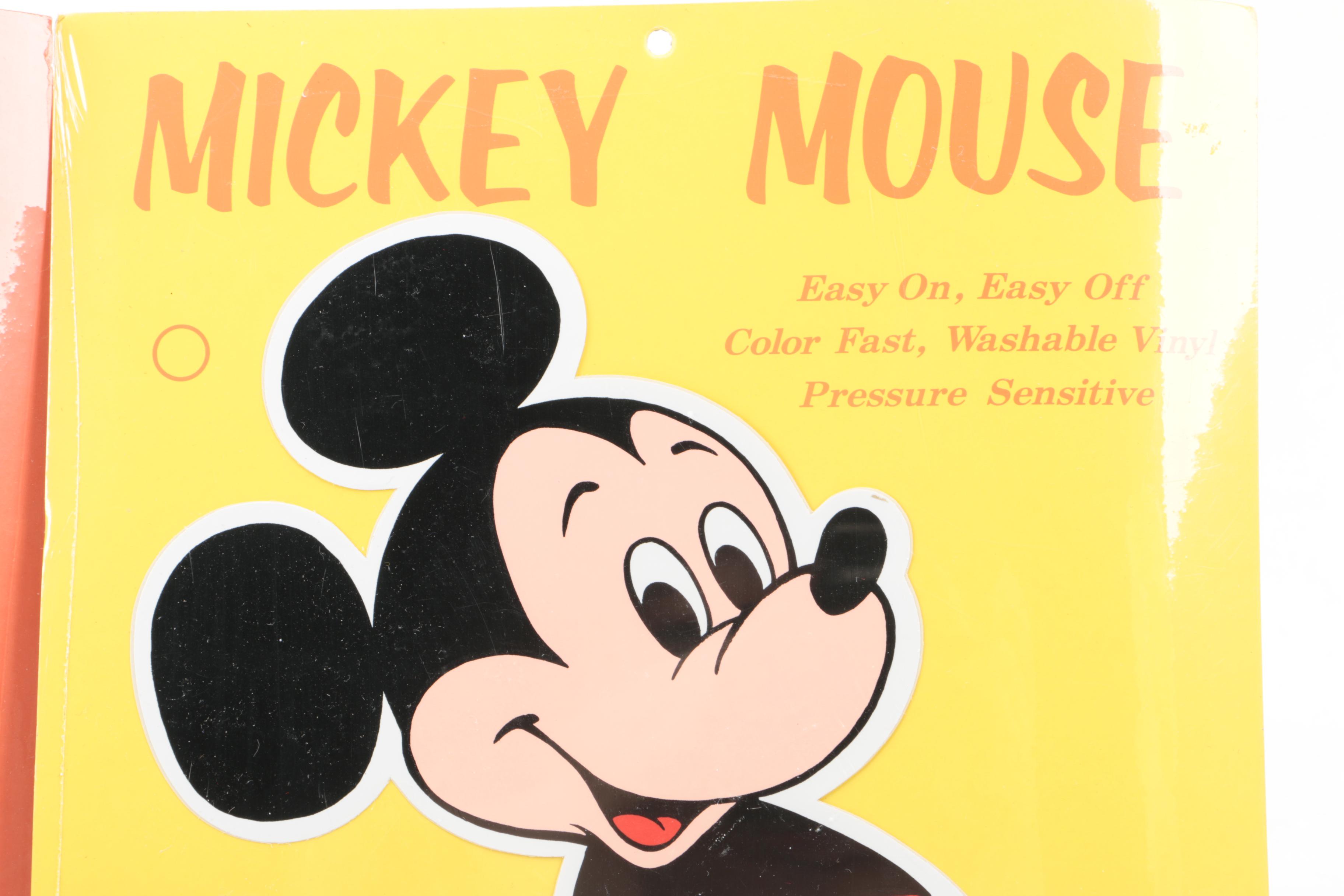 Disney Memorabilia Including Decals, Pencil Sharpener, and More