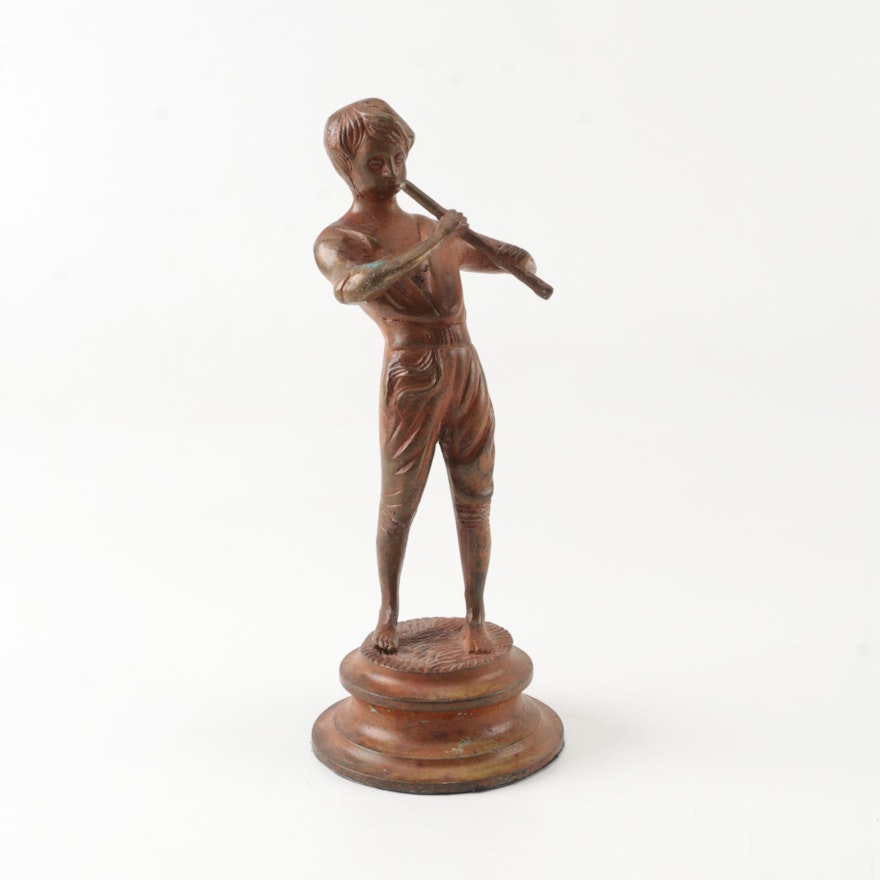 Metal Figurine of Boy Playing Flute