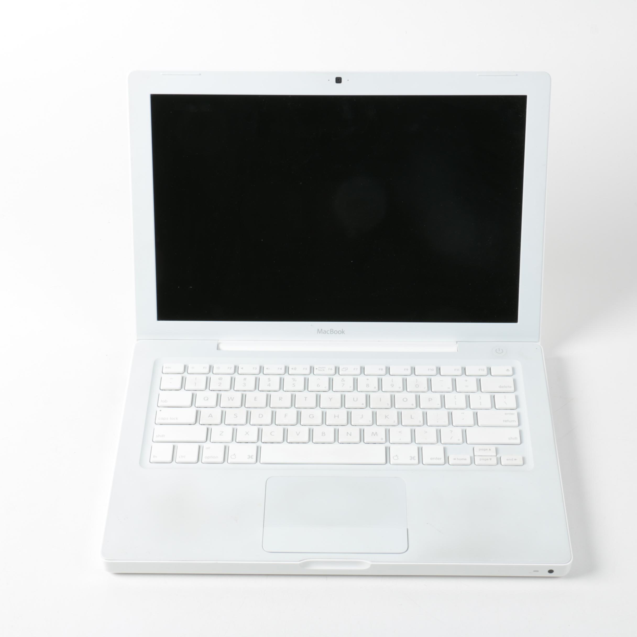 Apple "MacBook" Model "A1181"Laptop Computer And Powerstrip