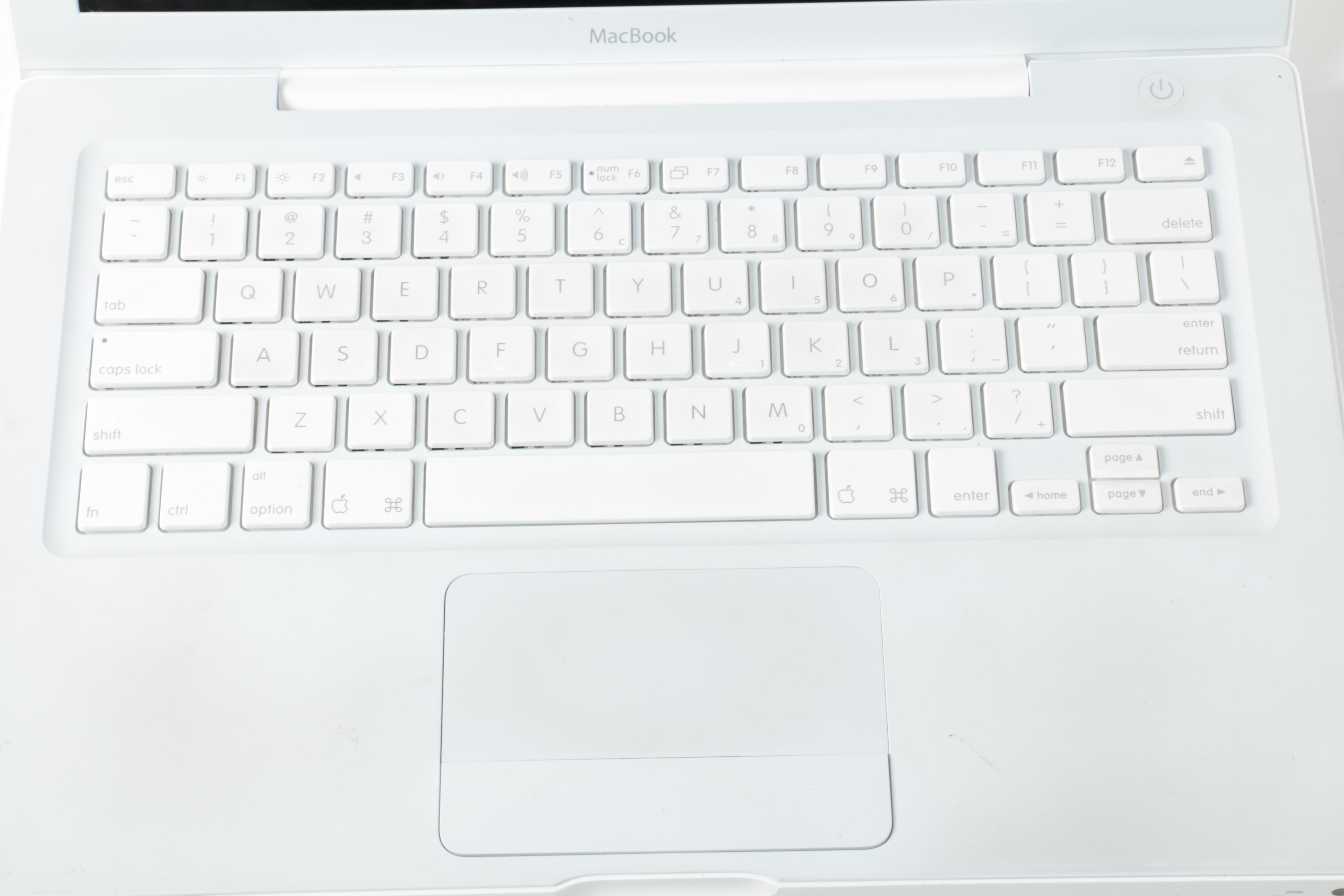 Apple "MacBook" Model "A1181"Laptop Computer And Powerstrip