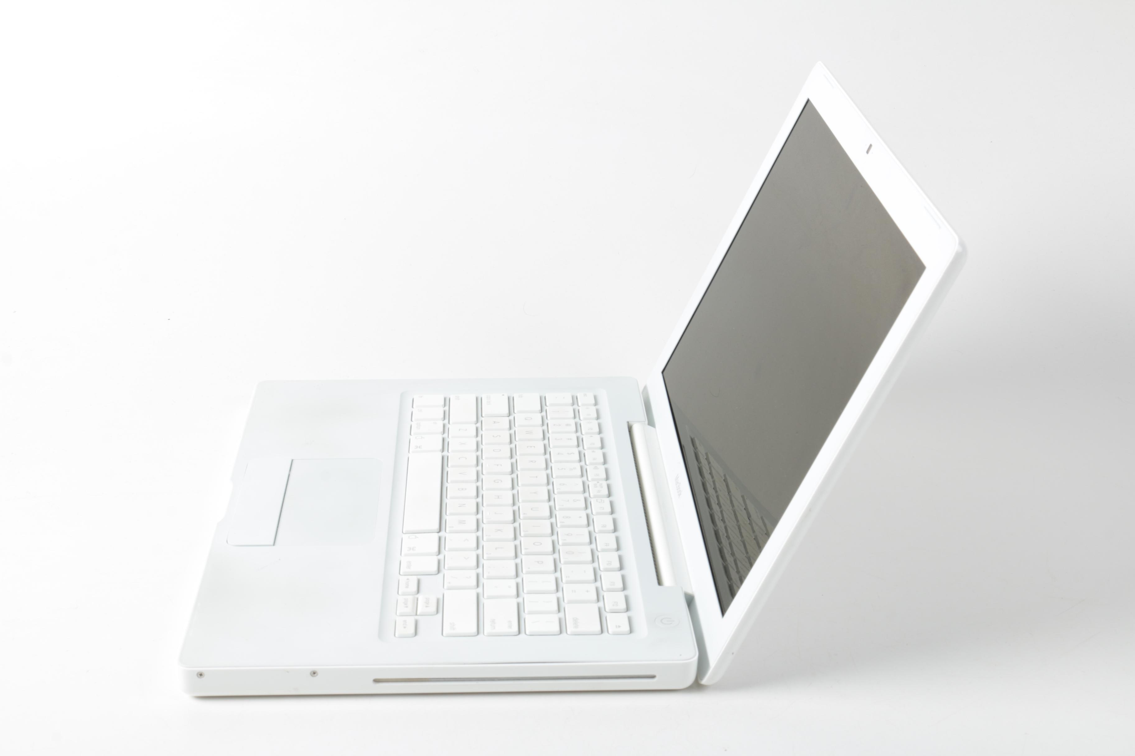 Apple "MacBook" Model "A1181"Laptop Computer And Powerstrip