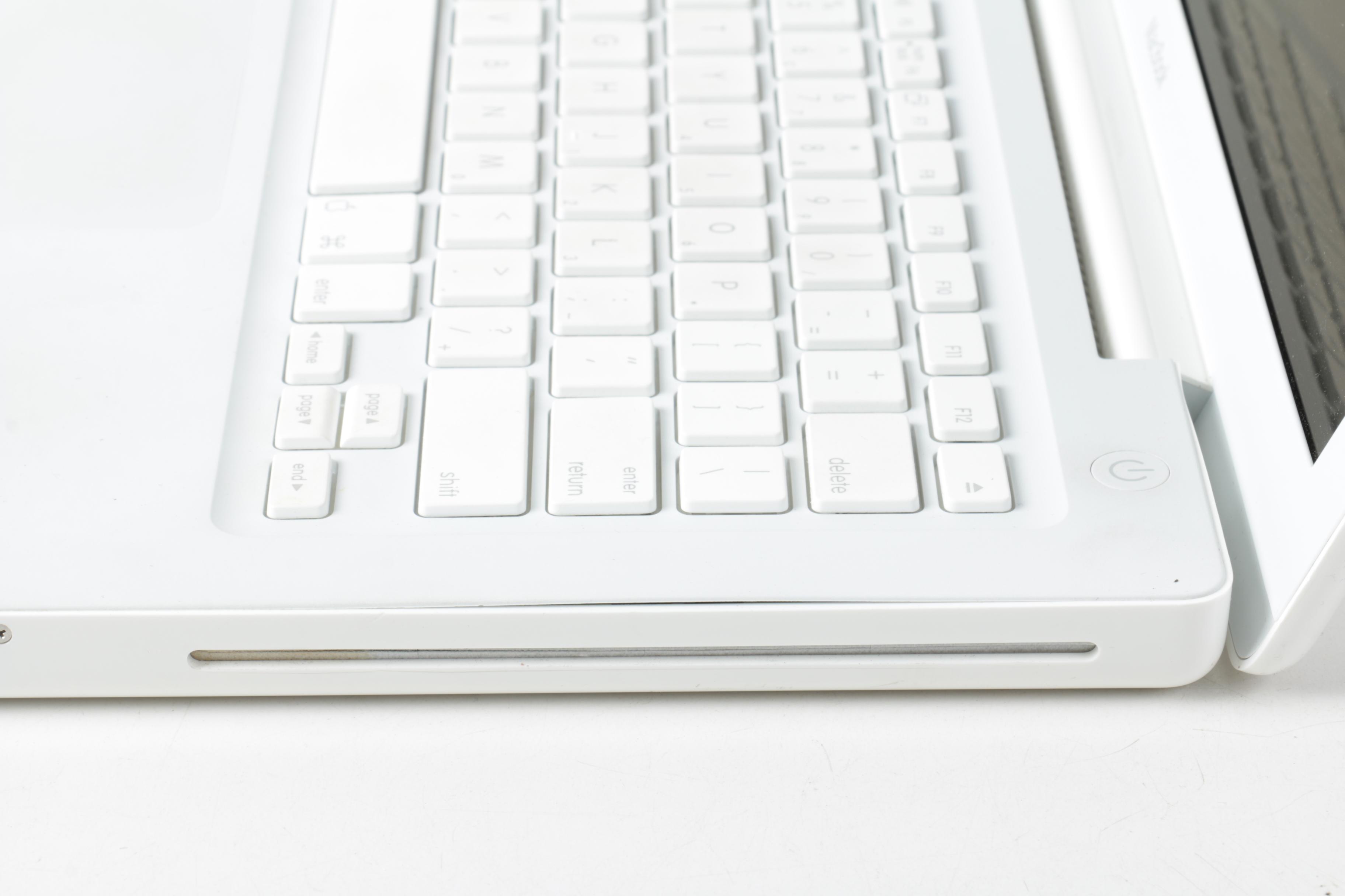 Apple "MacBook" Model "A1181"Laptop Computer And Powerstrip