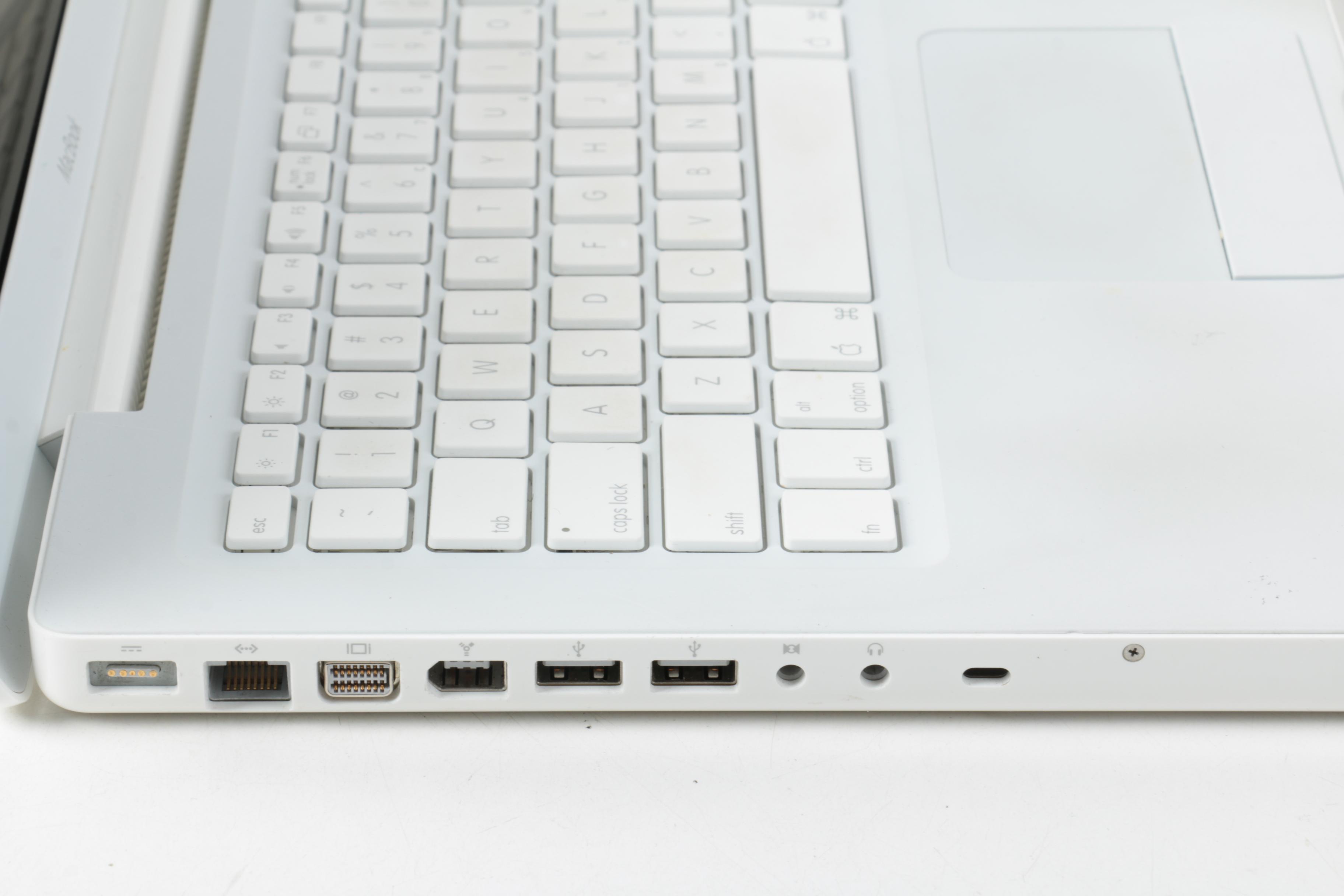 Apple "MacBook" Model "A1181"Laptop Computer And Powerstrip