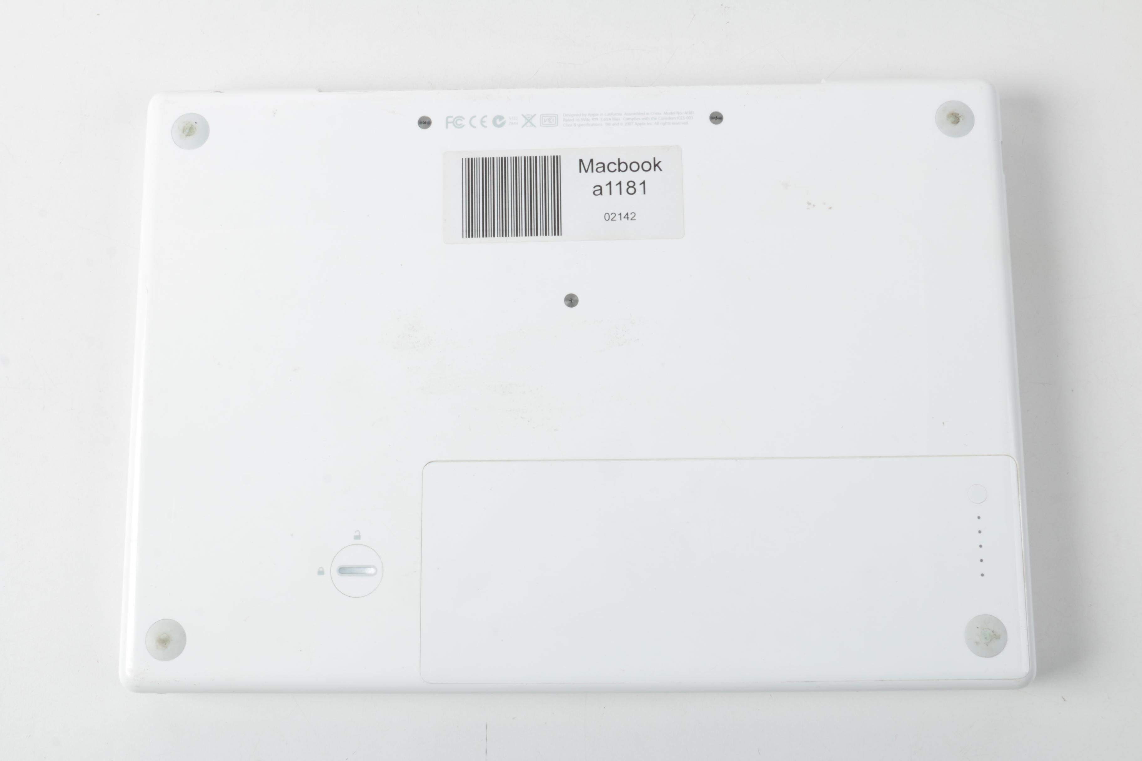 Apple "MacBook" Model "A1181"Laptop Computer And Powerstrip