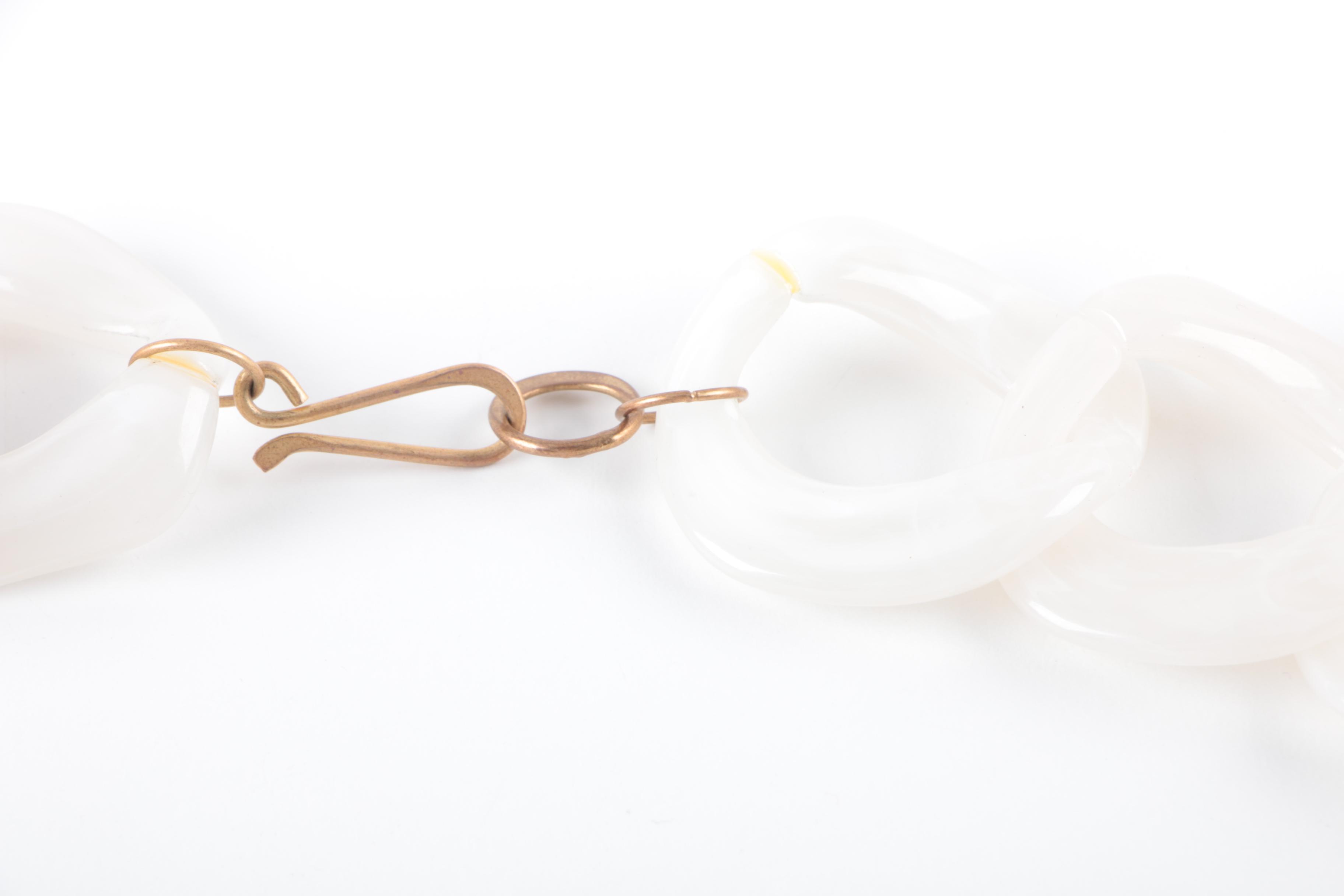 Collection of Costume Jewelry Featuring Coach Necklace and Swarovski Earrings