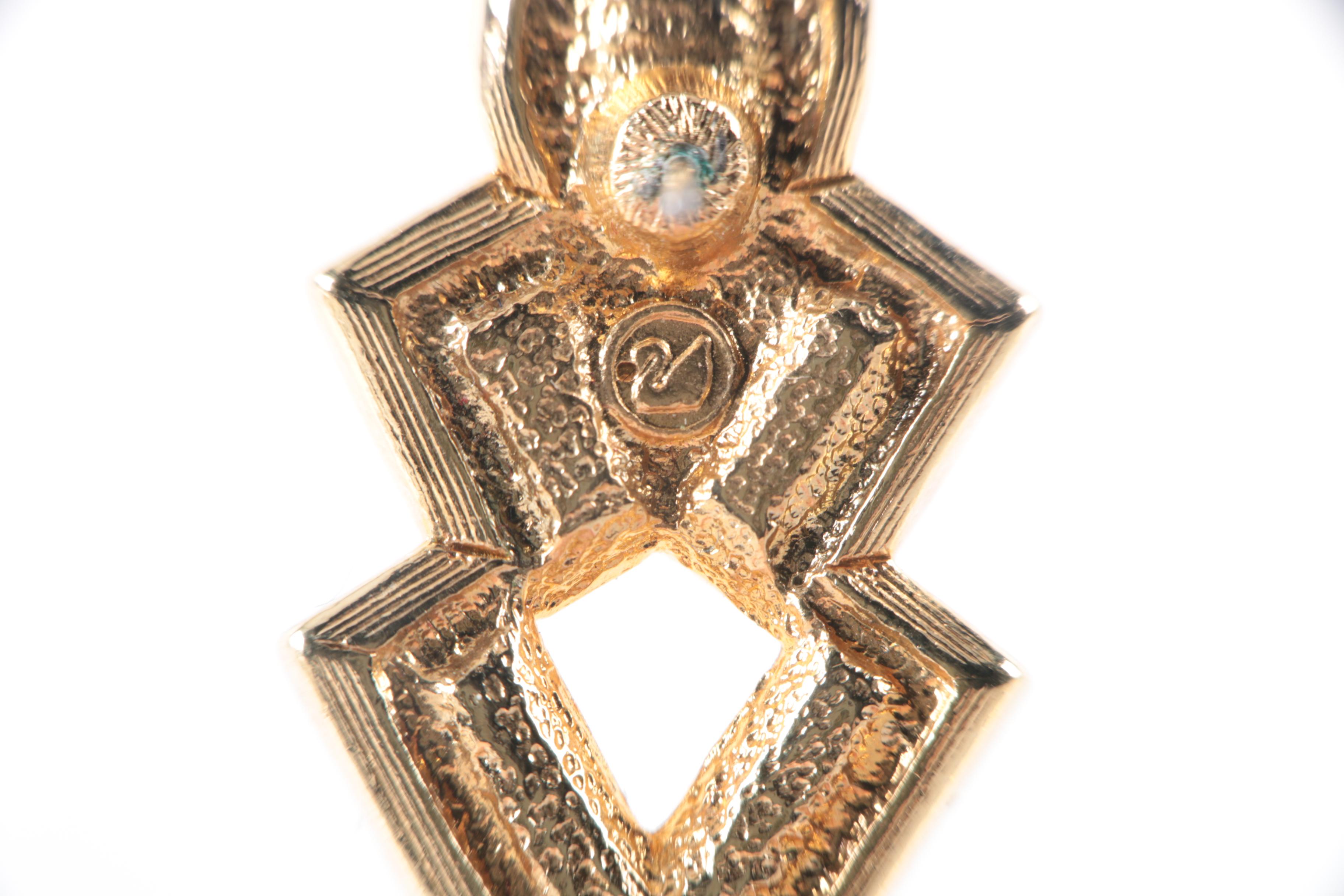 Collection of Costume Jewelry Featuring Coach Necklace and Swarovski Earrings