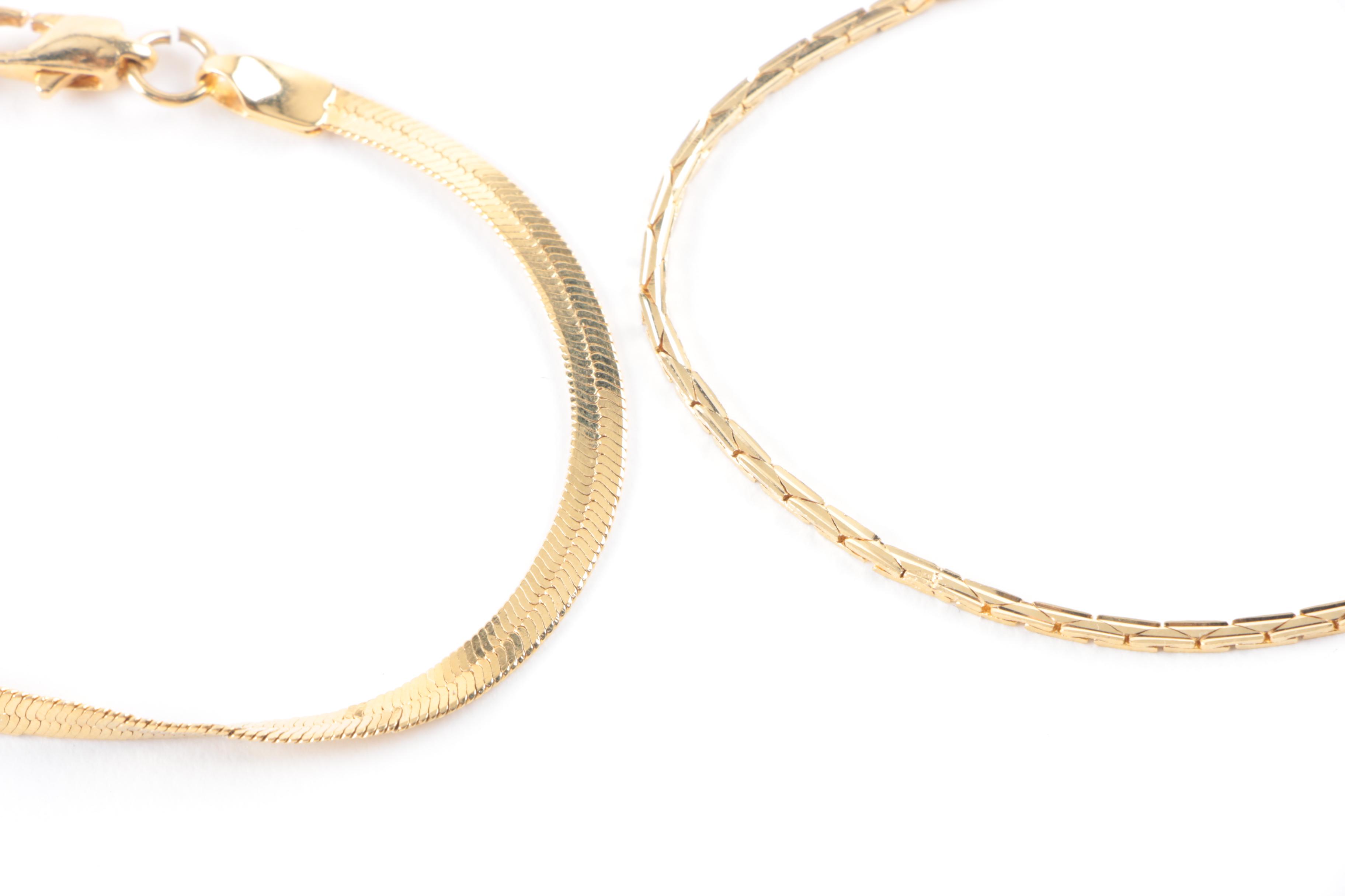 Collection of Costume Jewelry Featuring Coach Necklace and Swarovski Earrings