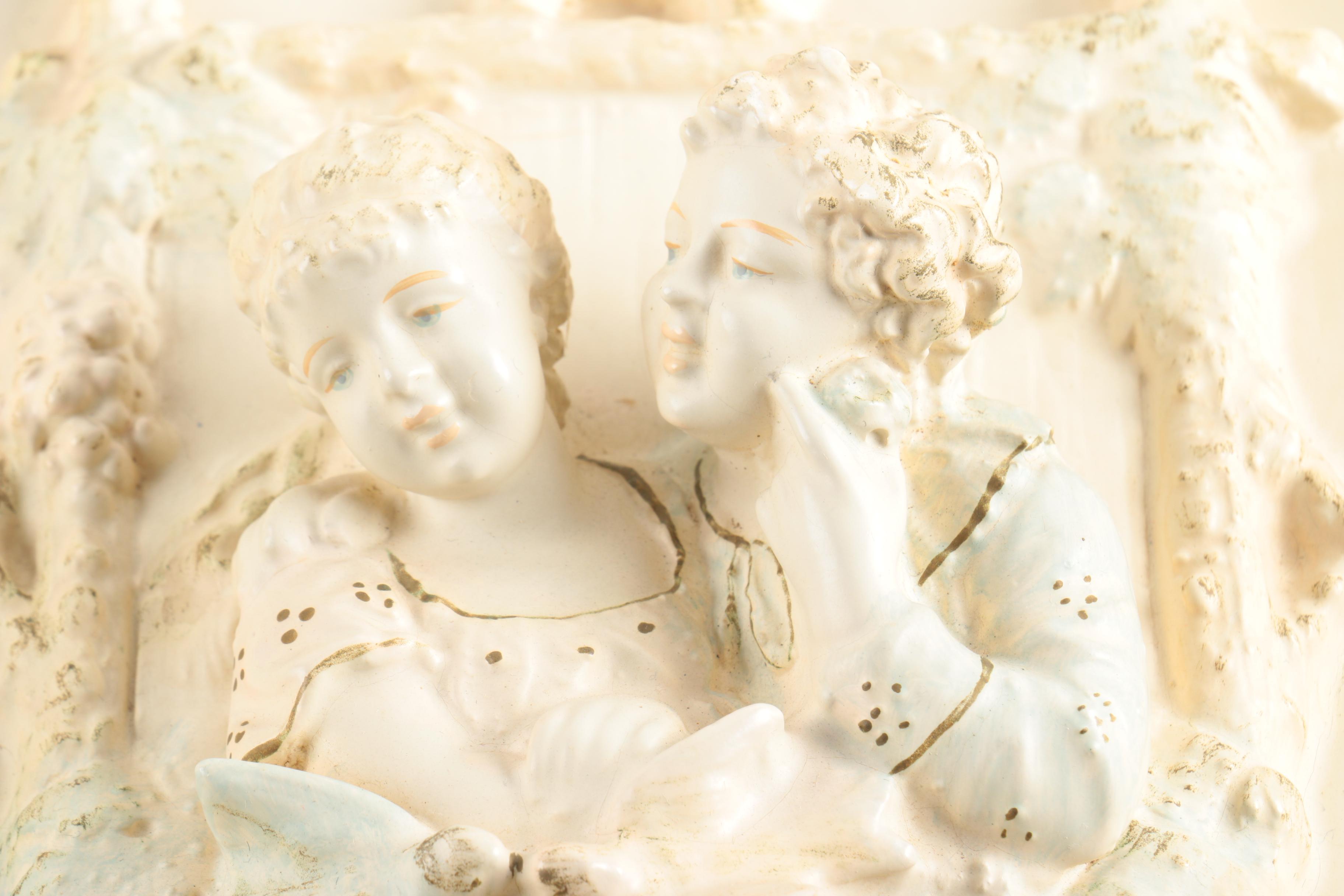 Pair of Vintage Chalkware Wall Hangings with Courtship Scenes in Relief