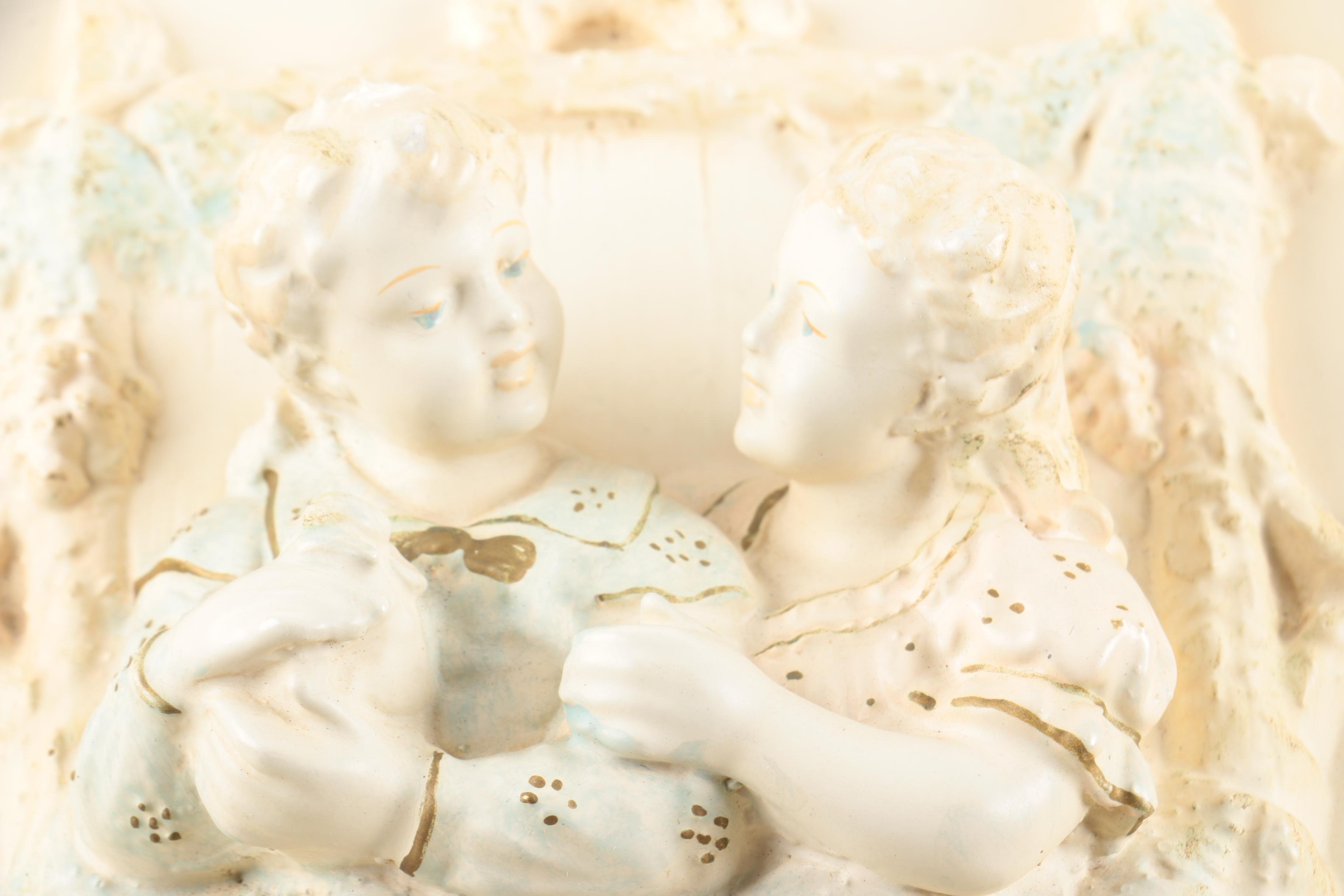 Pair of Vintage Chalkware Wall Hangings with Courtship Scenes in Relief