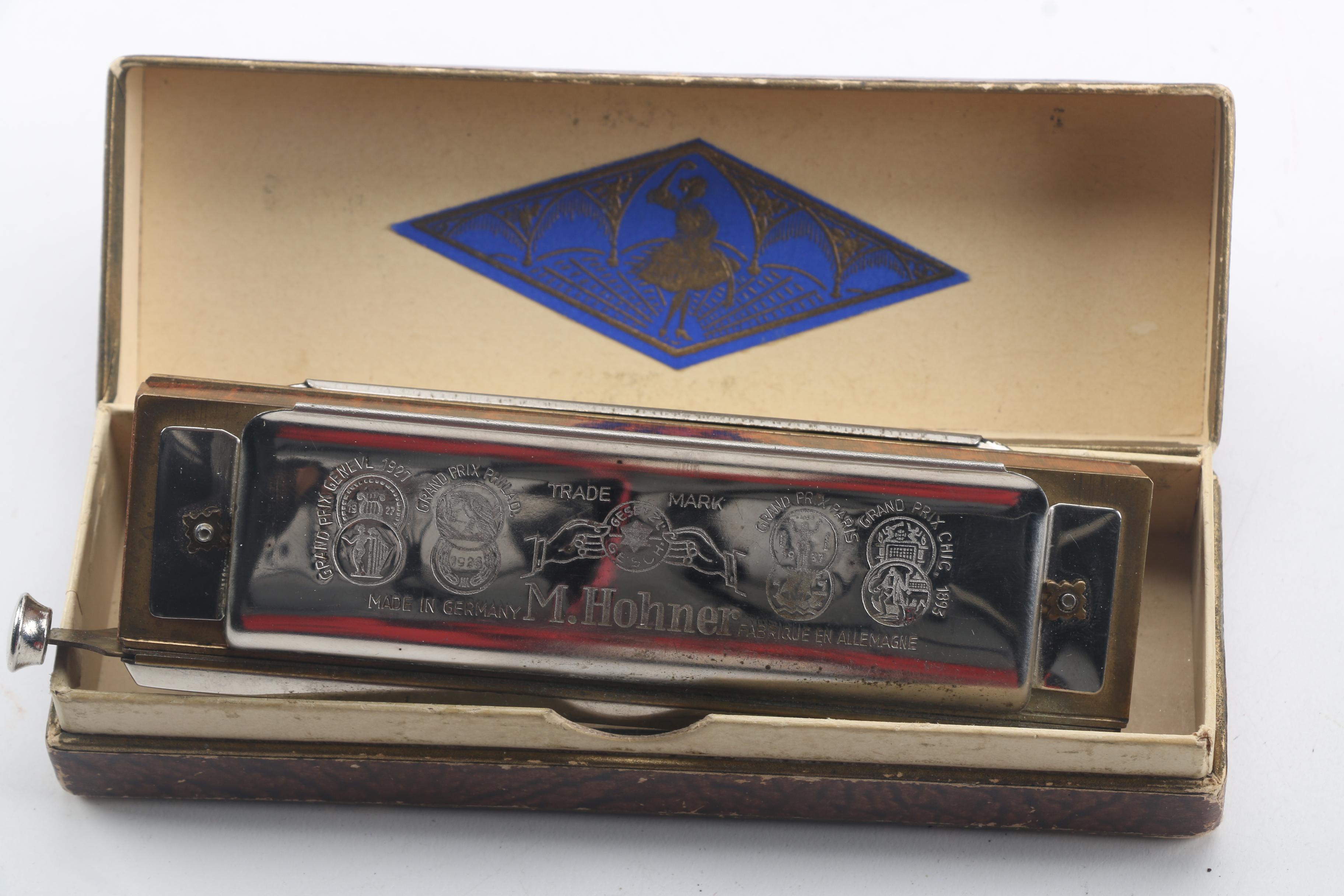 Buescher Aristocrat Flute and Hohner Harmonicas