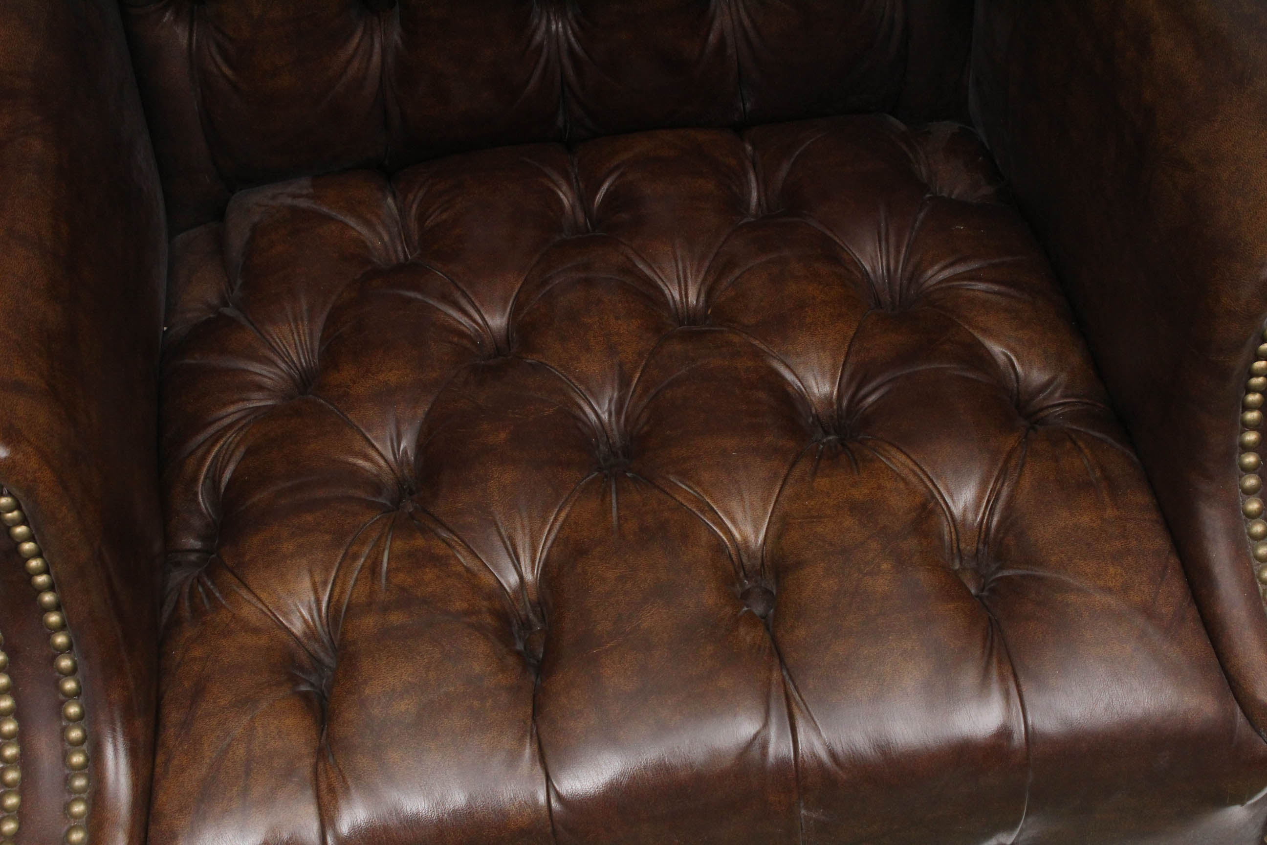 Two Vintage Faux Leather Wing Back Chairs by Sam Moore