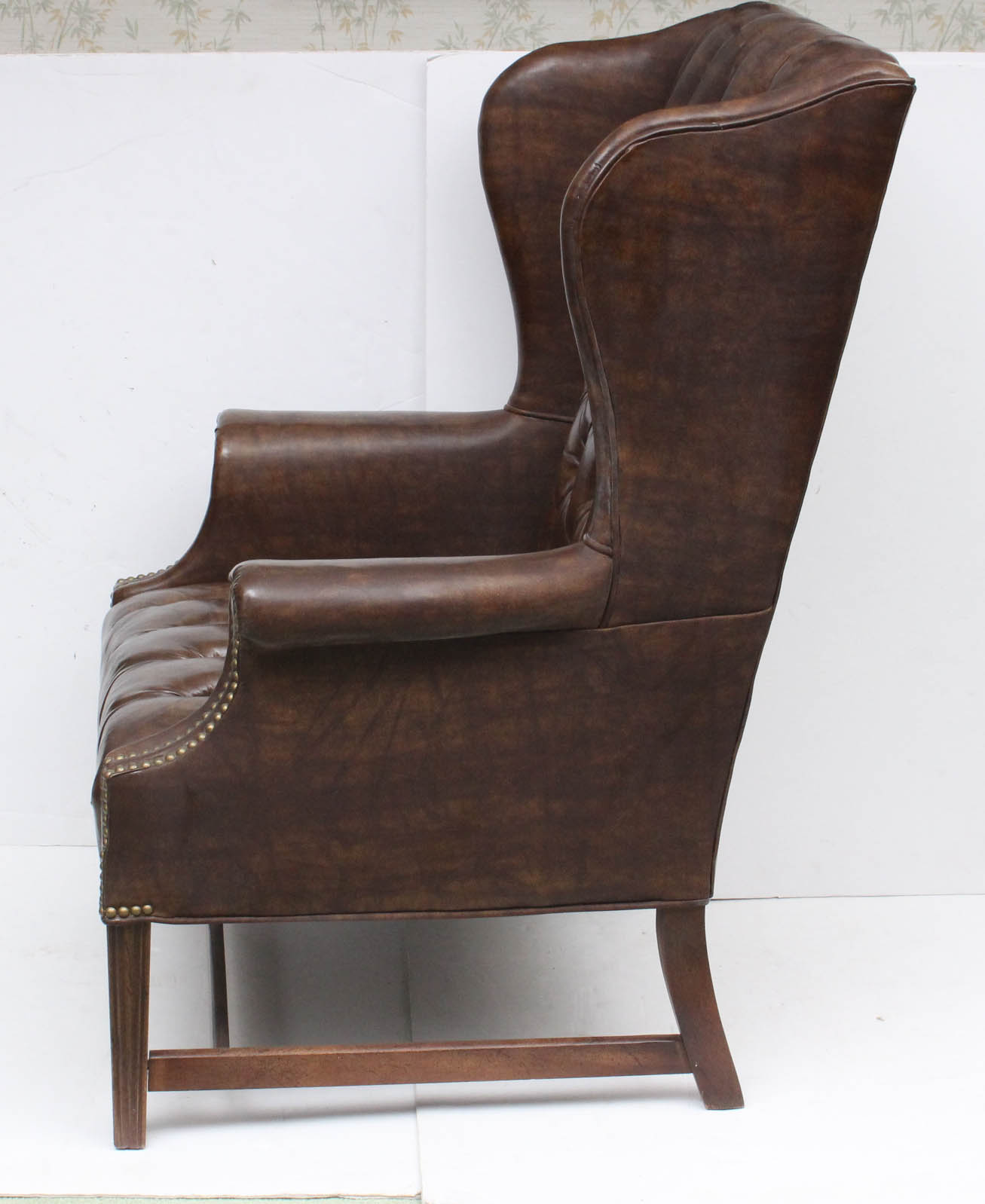 Two Vintage Faux Leather Wing Back Chairs by Sam Moore