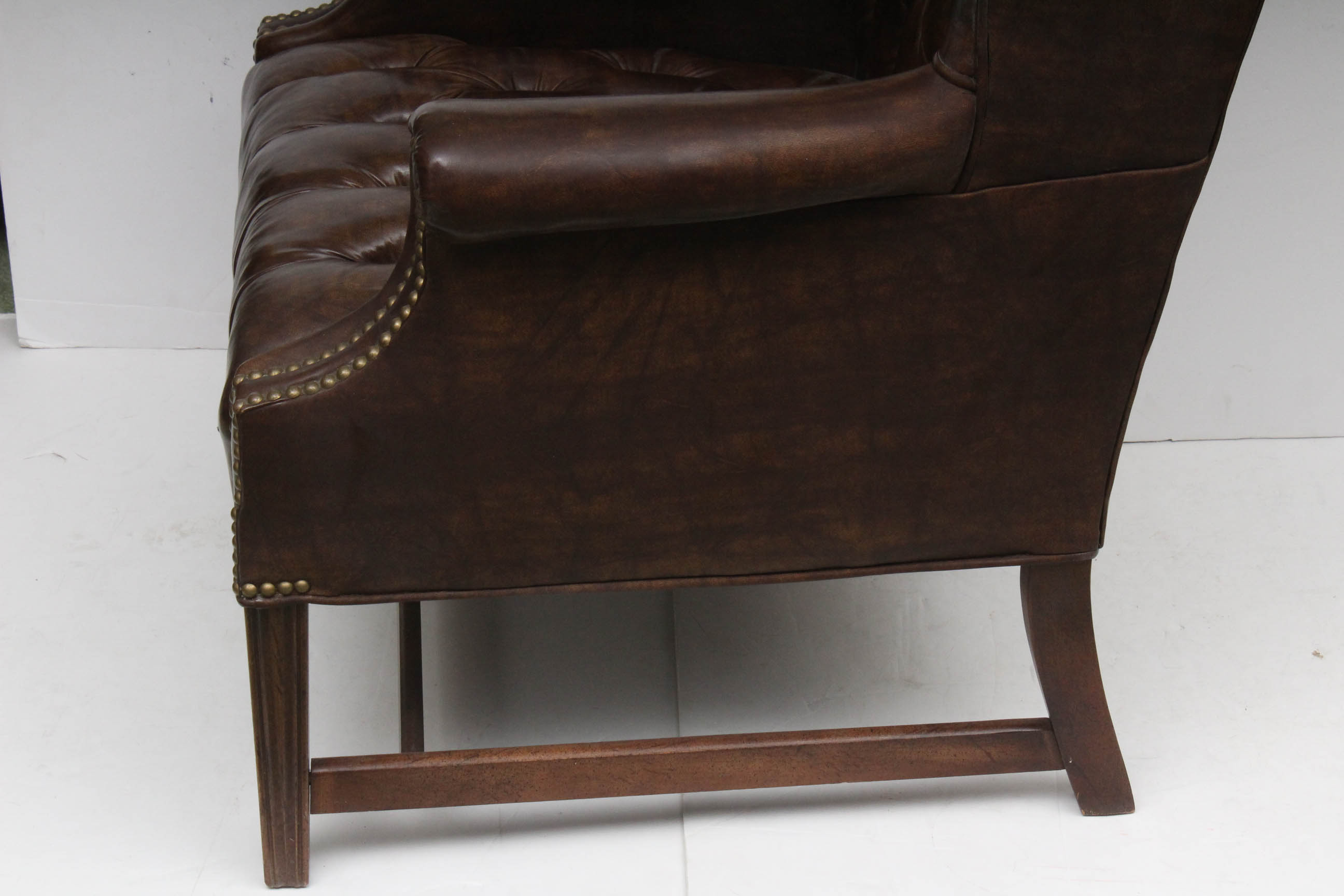 Two Vintage Faux Leather Wing Back Chairs by Sam Moore