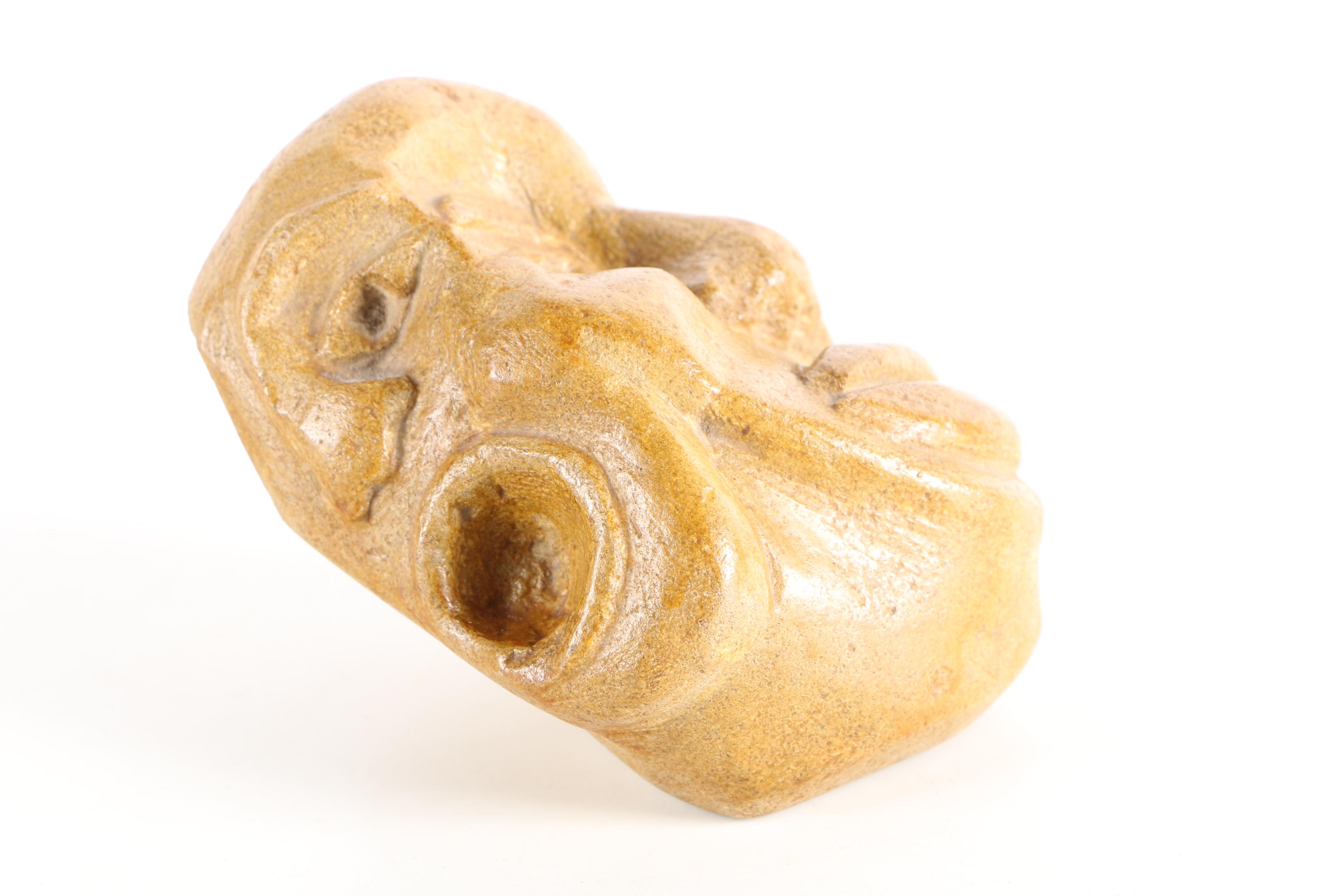 Limestone Sculpture of Stylized Faces