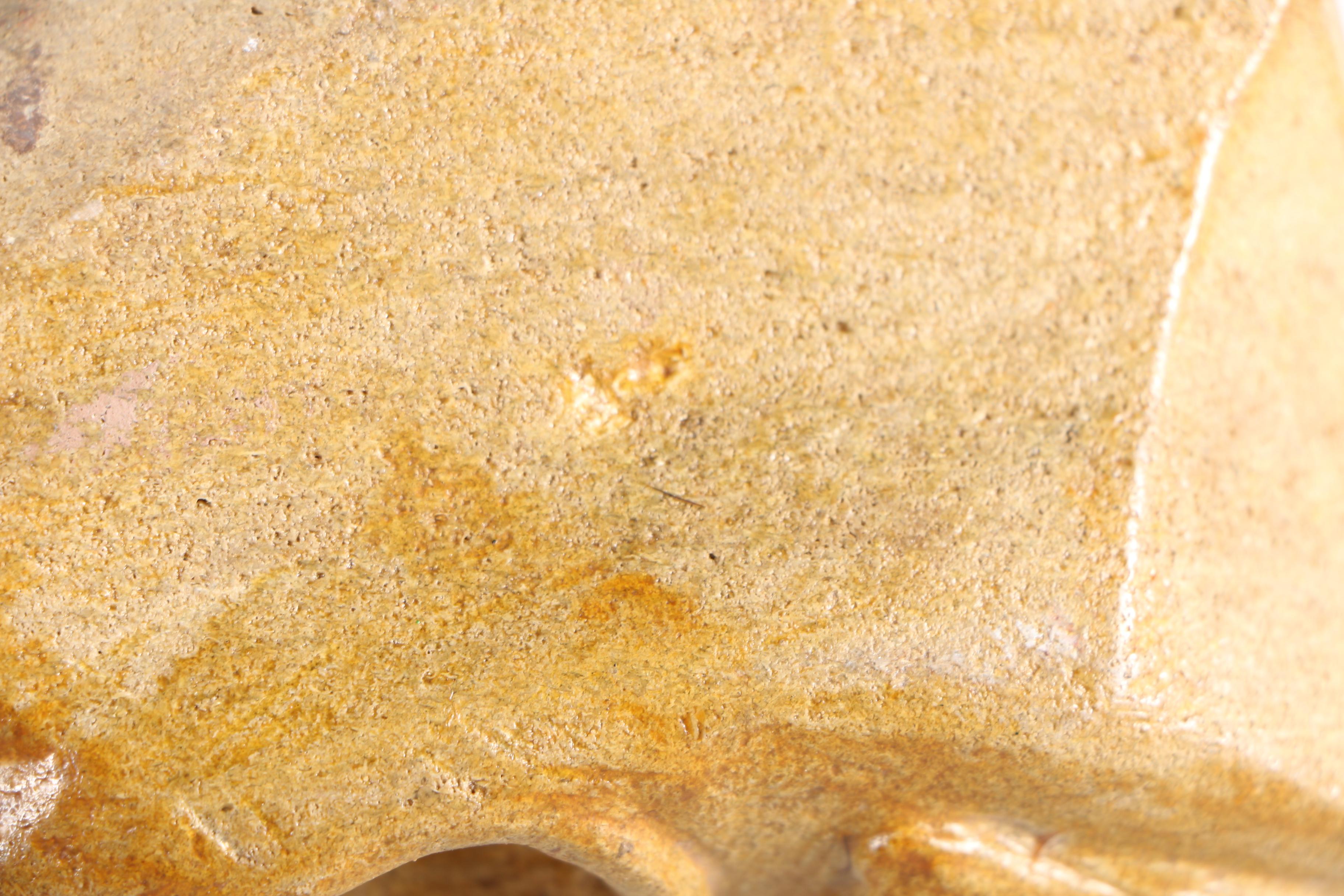 Limestone Sculpture of Stylized Faces