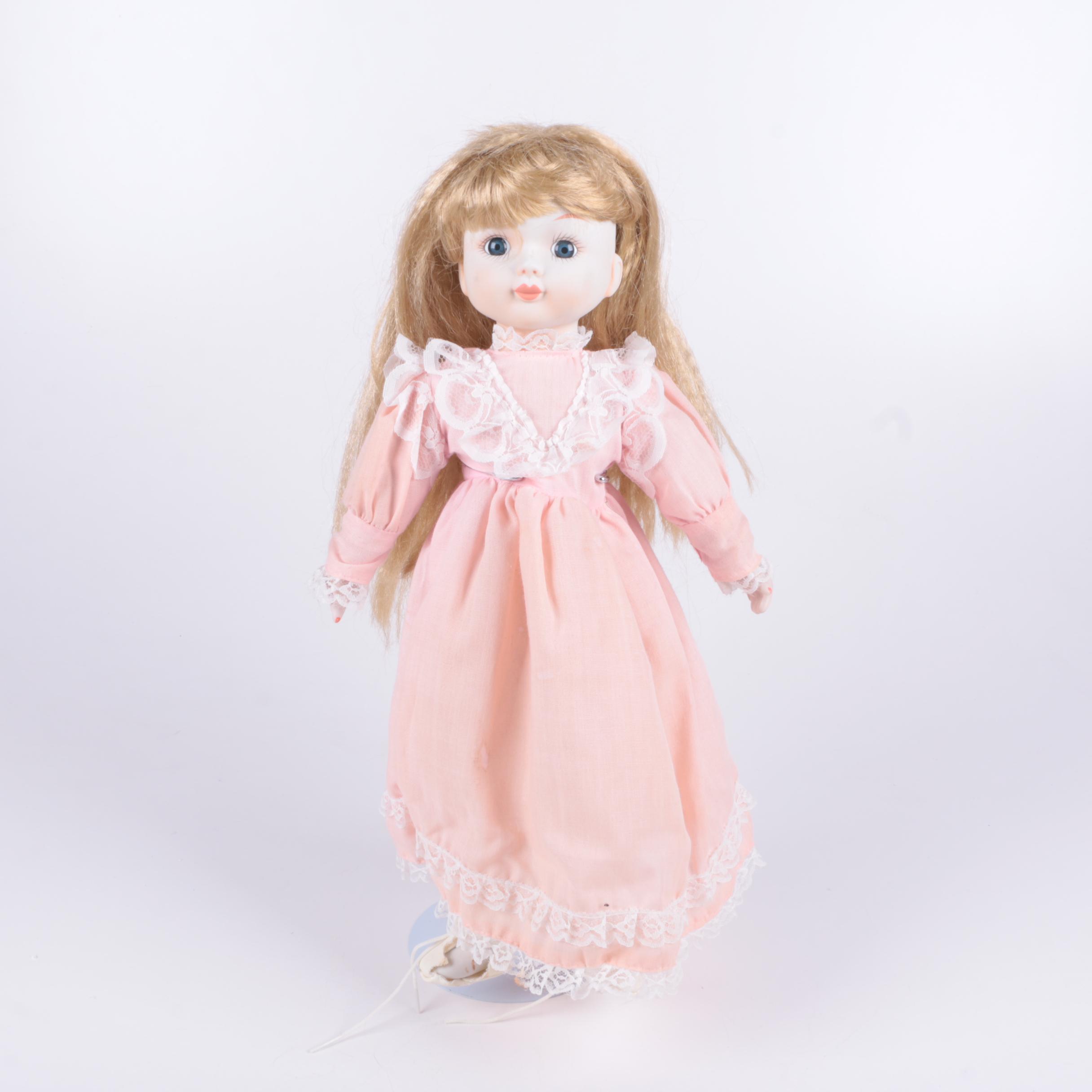 Vintage Blonde Porcelain Doll in Peach Dress