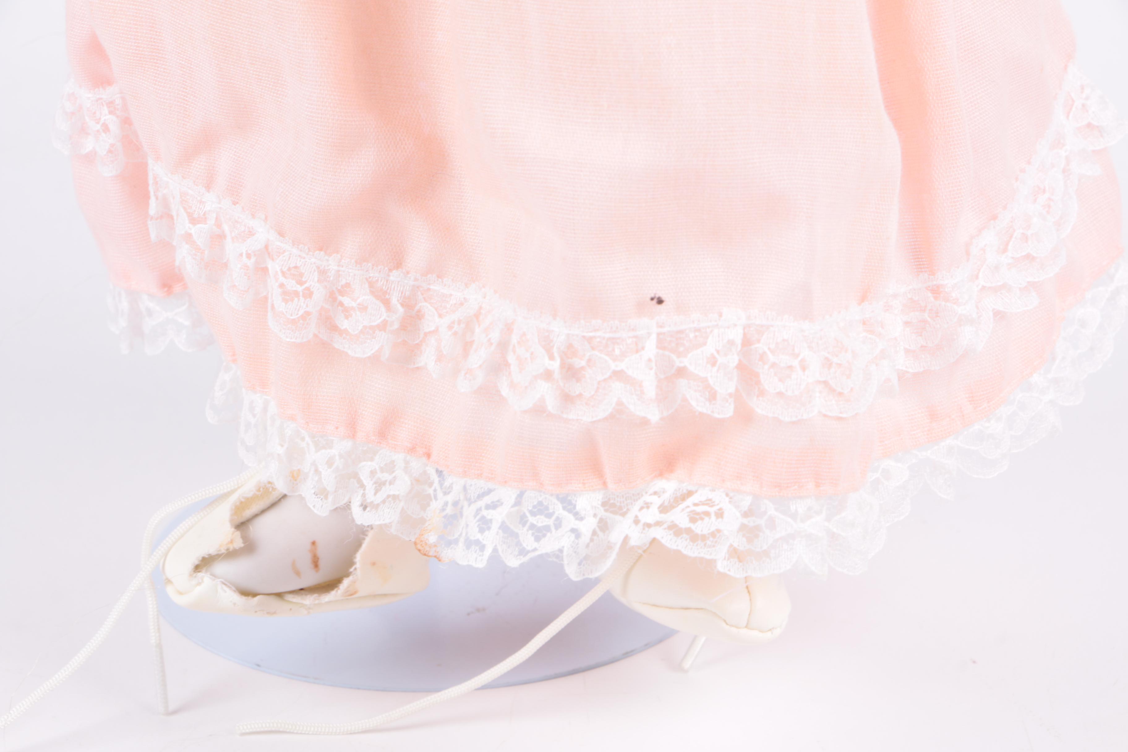 Vintage Blonde Porcelain Doll in Peach Dress