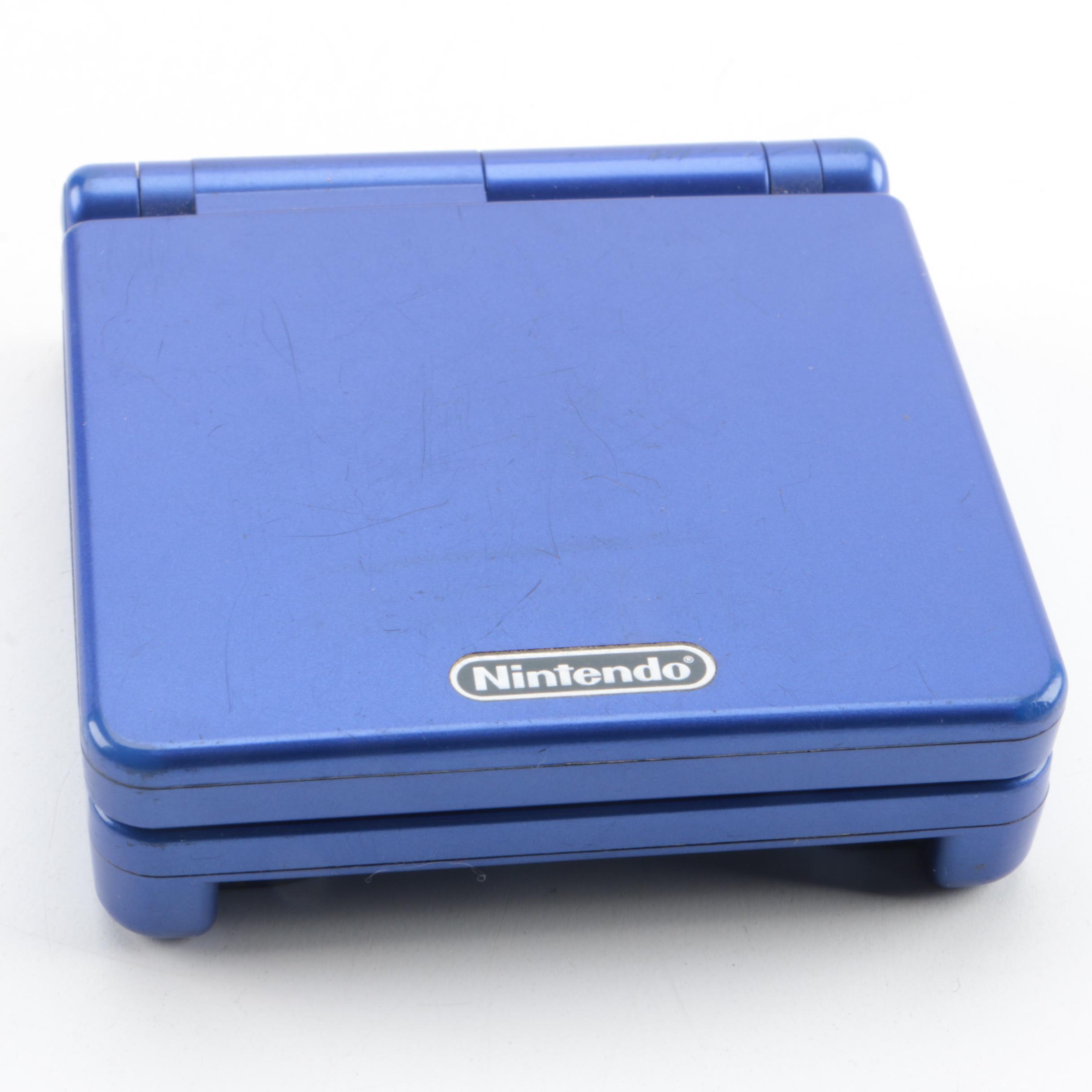 Game Boy Advance SP, Games and Case Featuring Pokémon Ruby and Sapphire