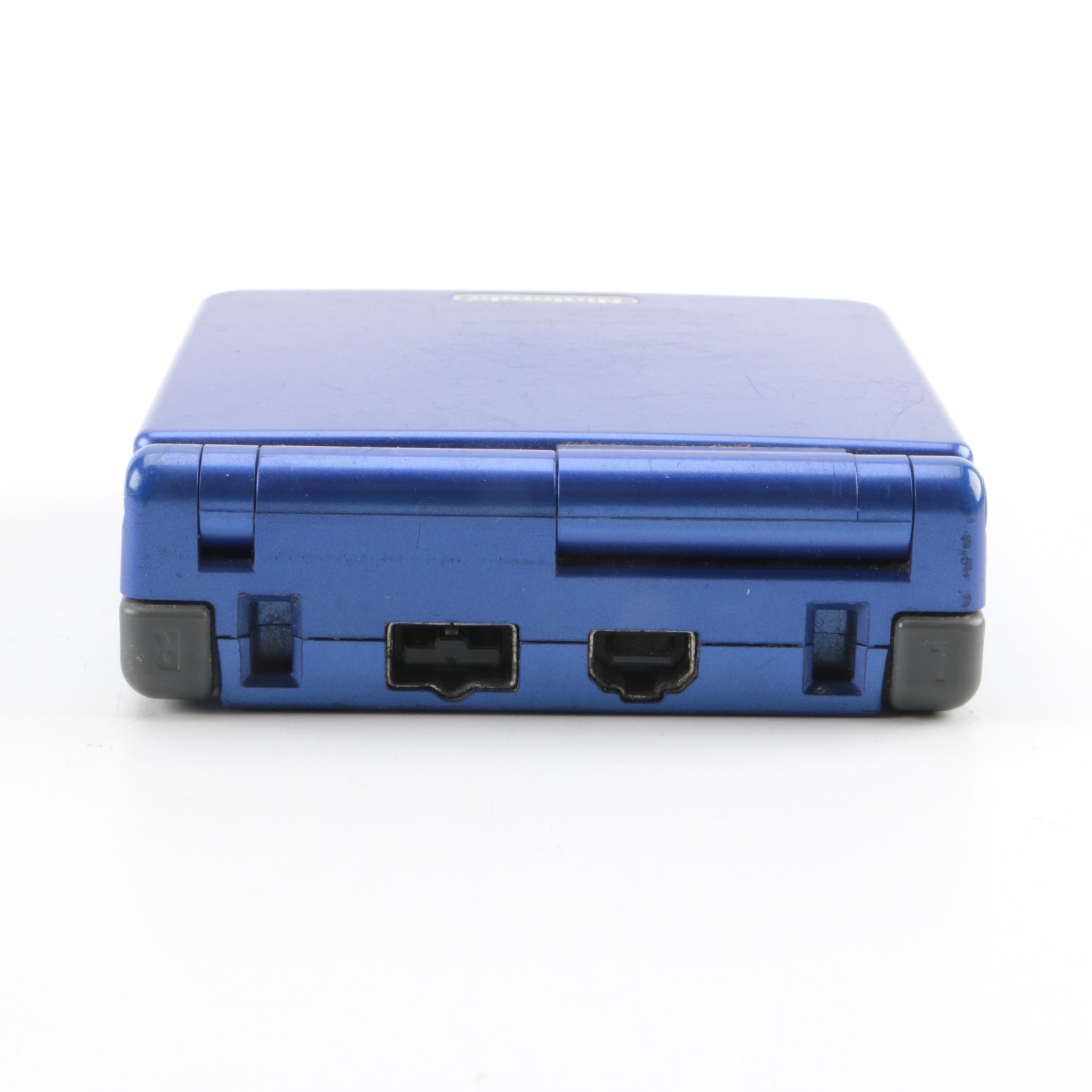 Game Boy Advance SP, Games and Case Featuring Pokémon Ruby and Sapphire