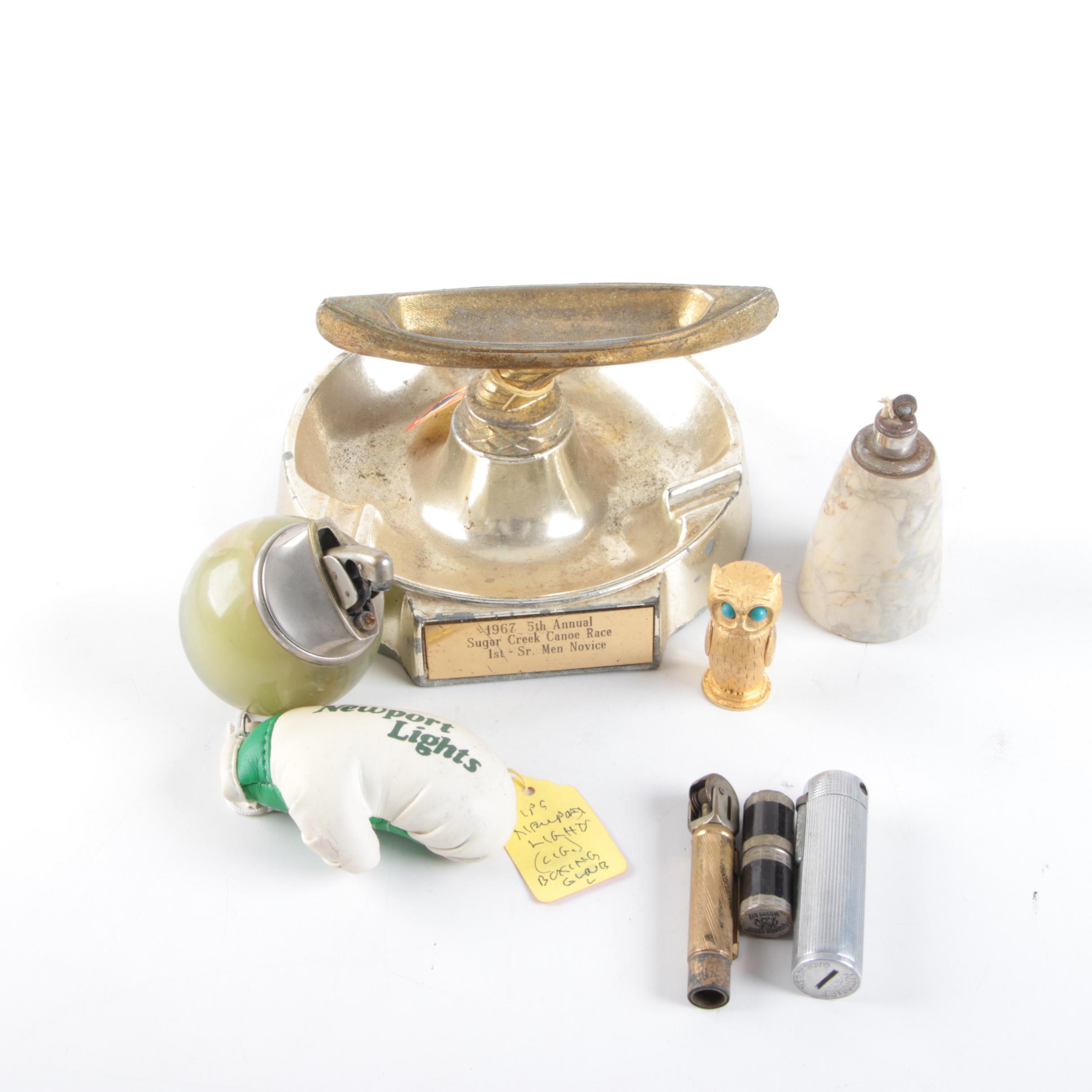 Vintage Trophy Ash Receiver, Newport Lights Boxing Glove, and Lighters