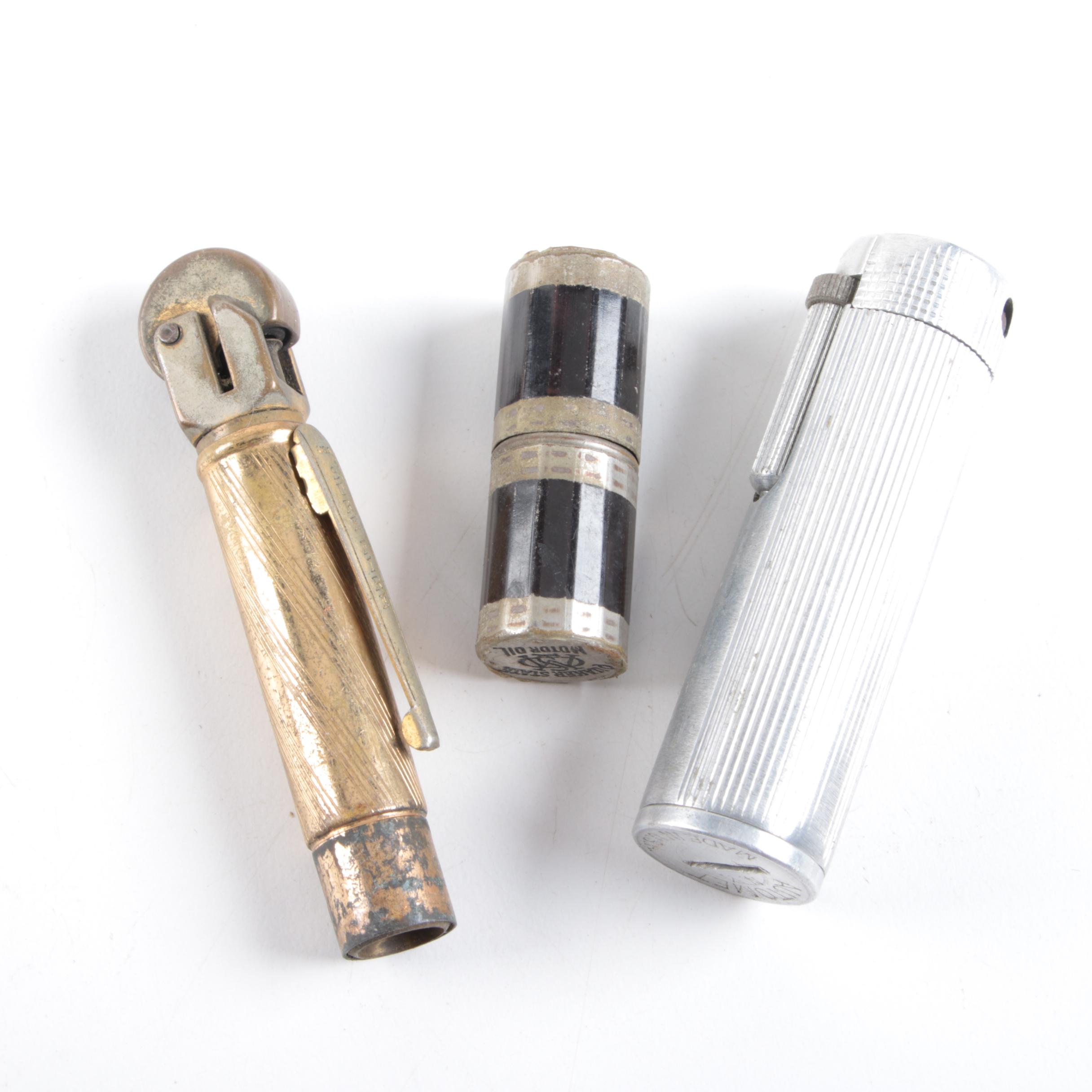 Vintage Trophy Ash Receiver, Newport Lights Boxing Glove, and Lighters