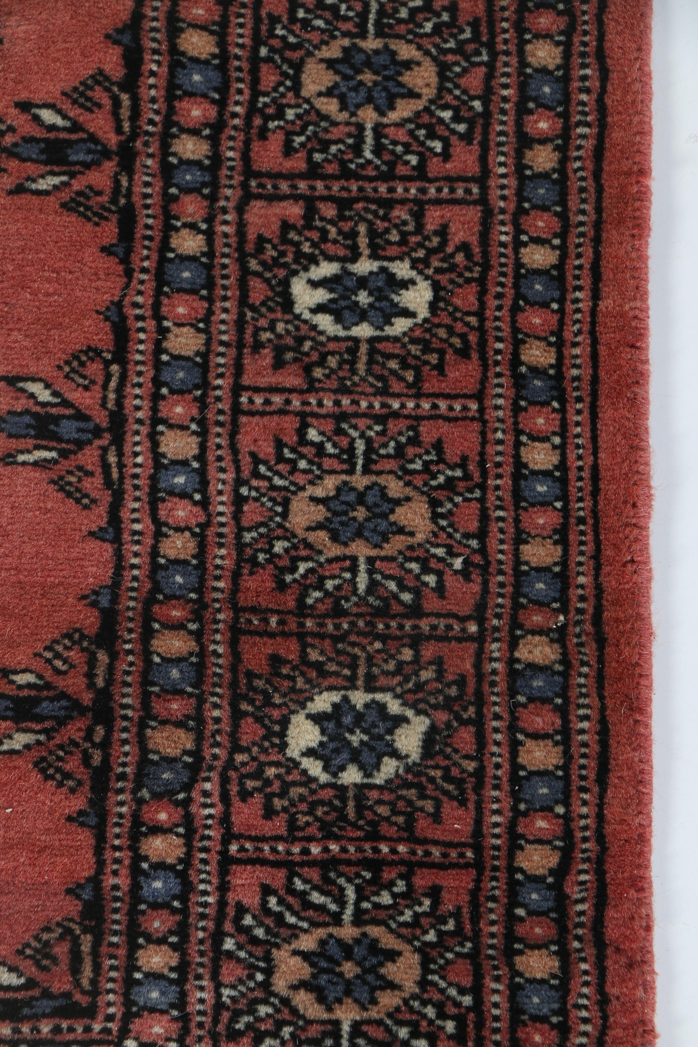 Pair of Hand-Knotted Tekke Bokhara Wool Accent Rugs