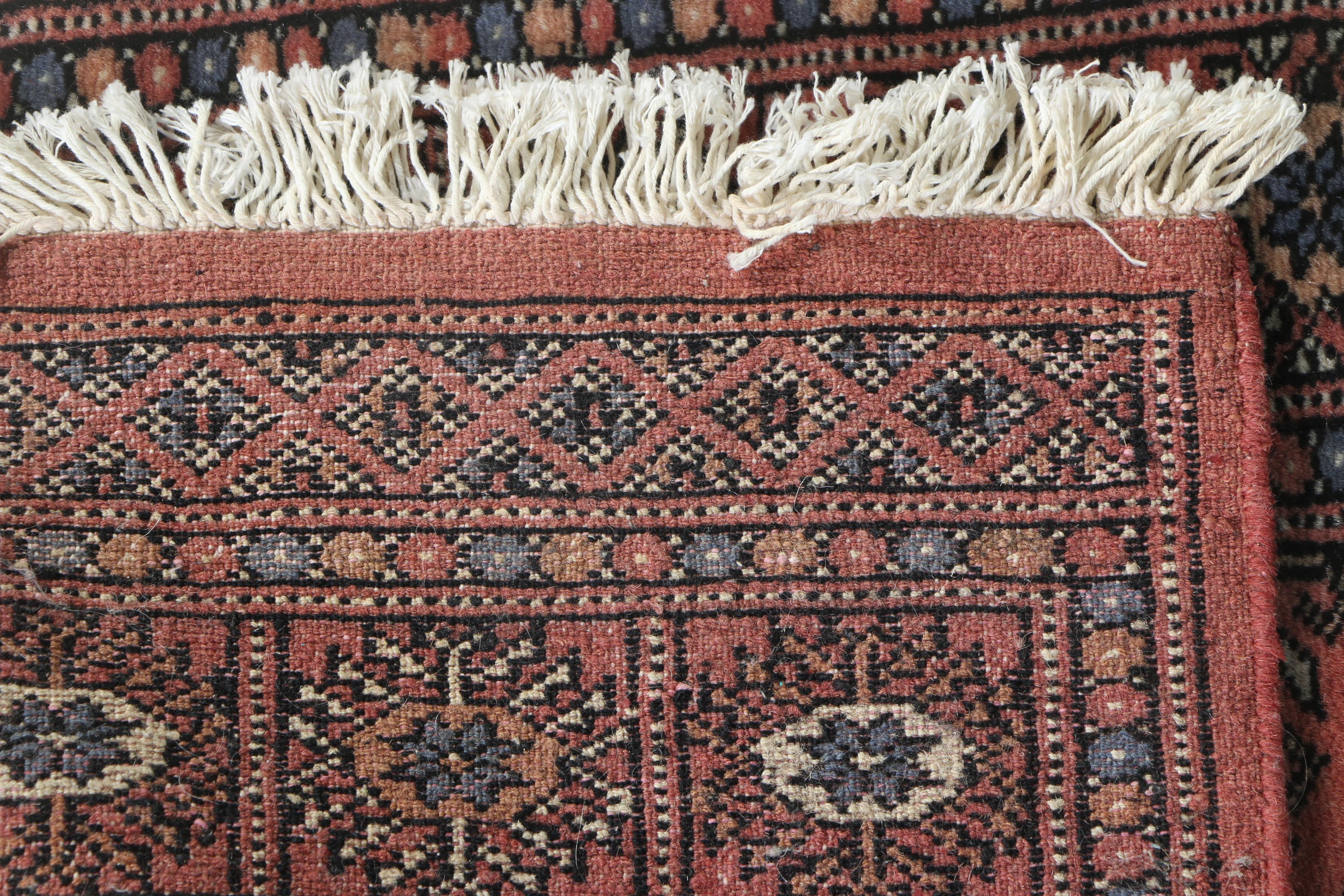 Pair of Hand-Knotted Tekke Bokhara Wool Accent Rugs