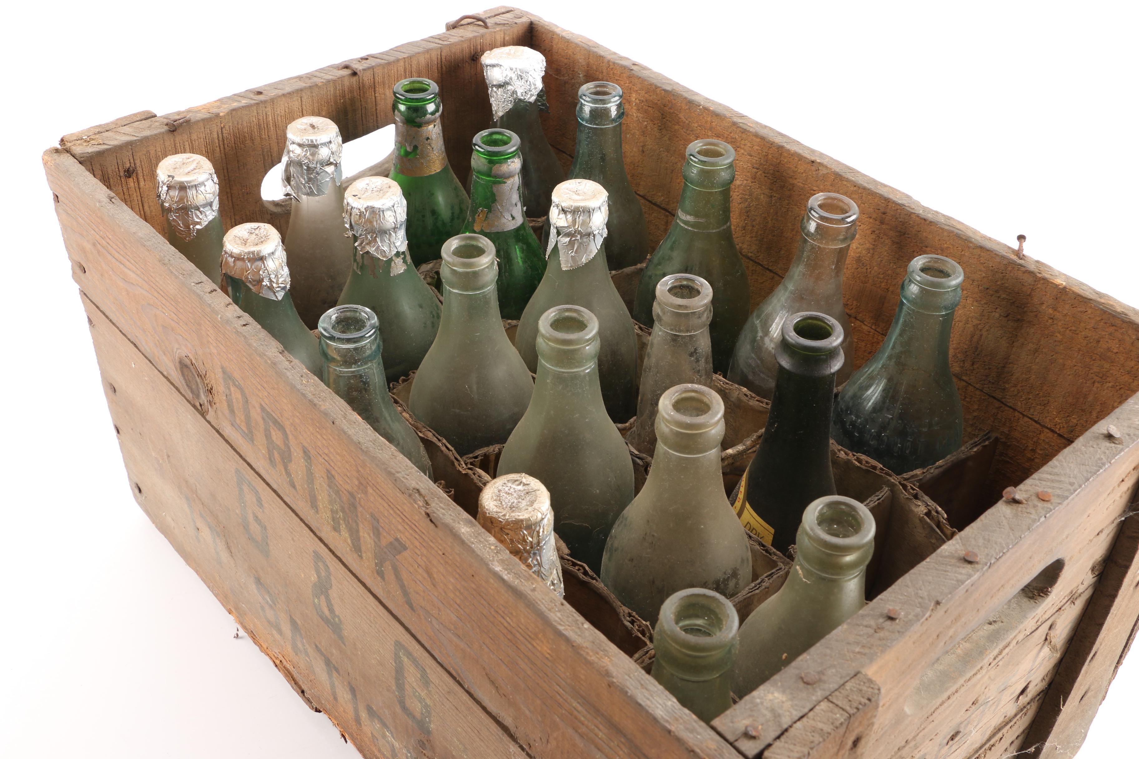 Vintage Glass Bottles in Wooden Crate