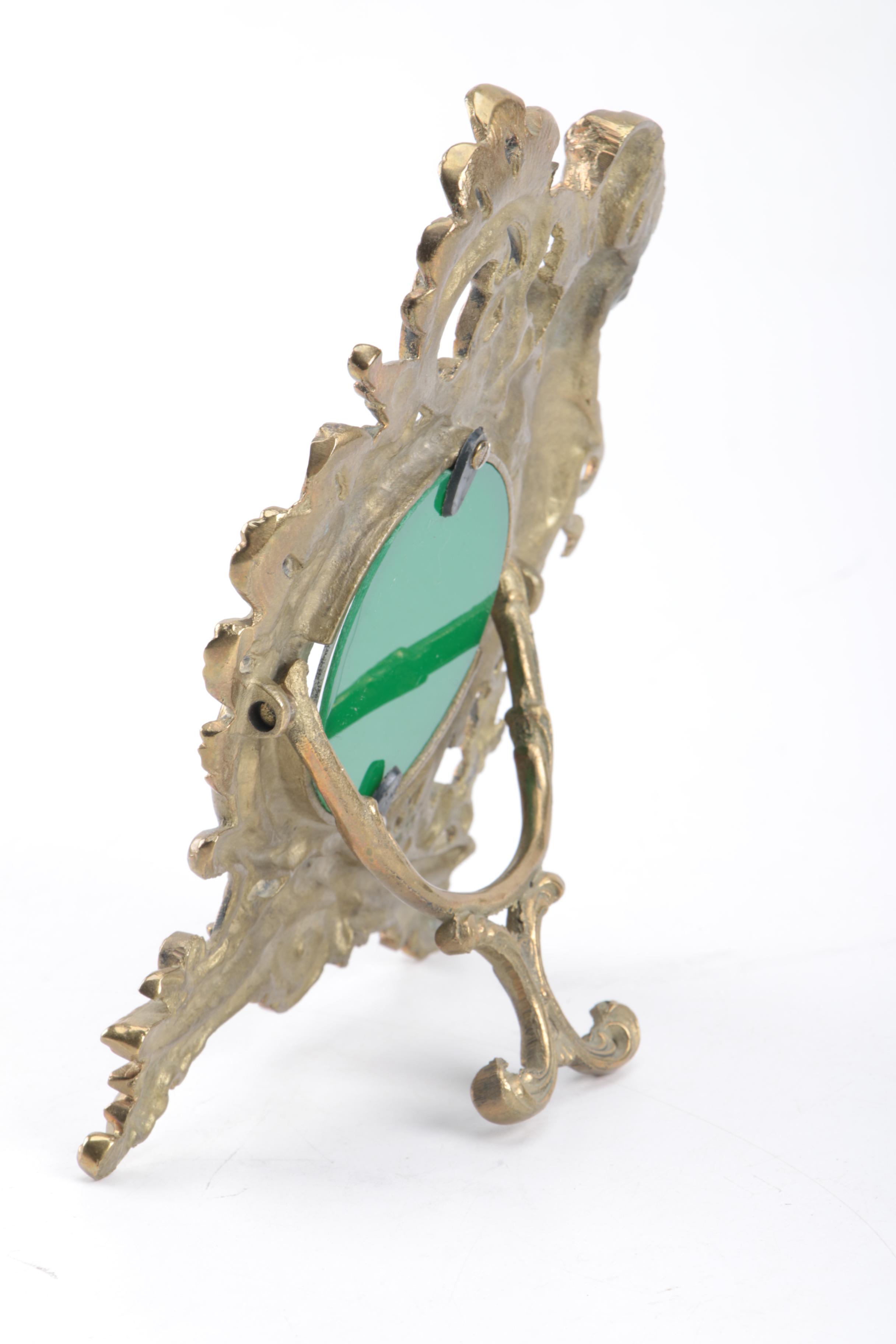 Ornate Freestanding Metal Picture Frame with Cherub Accent