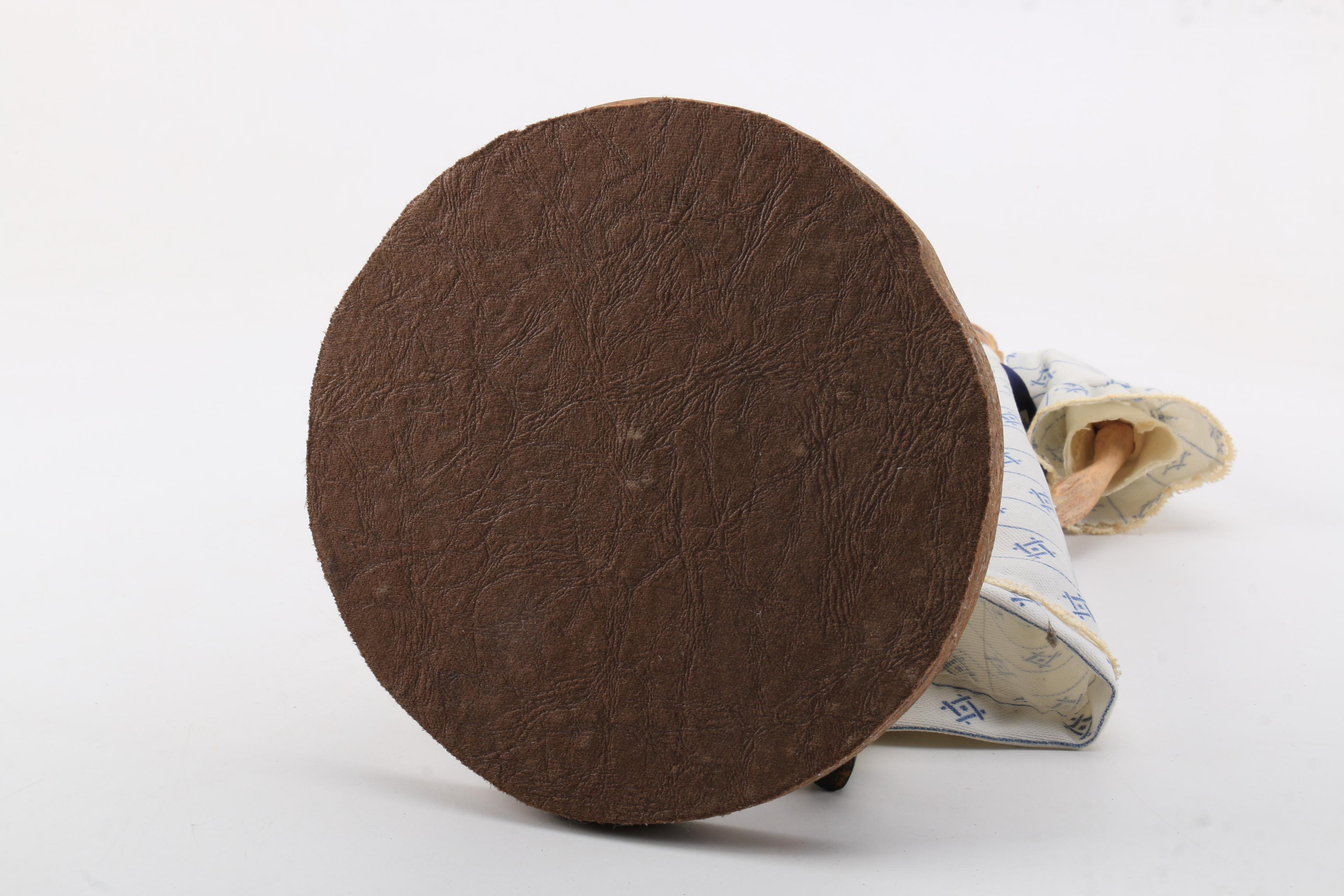 Carved Wood Doll Featuring a Detailed and Painted Face