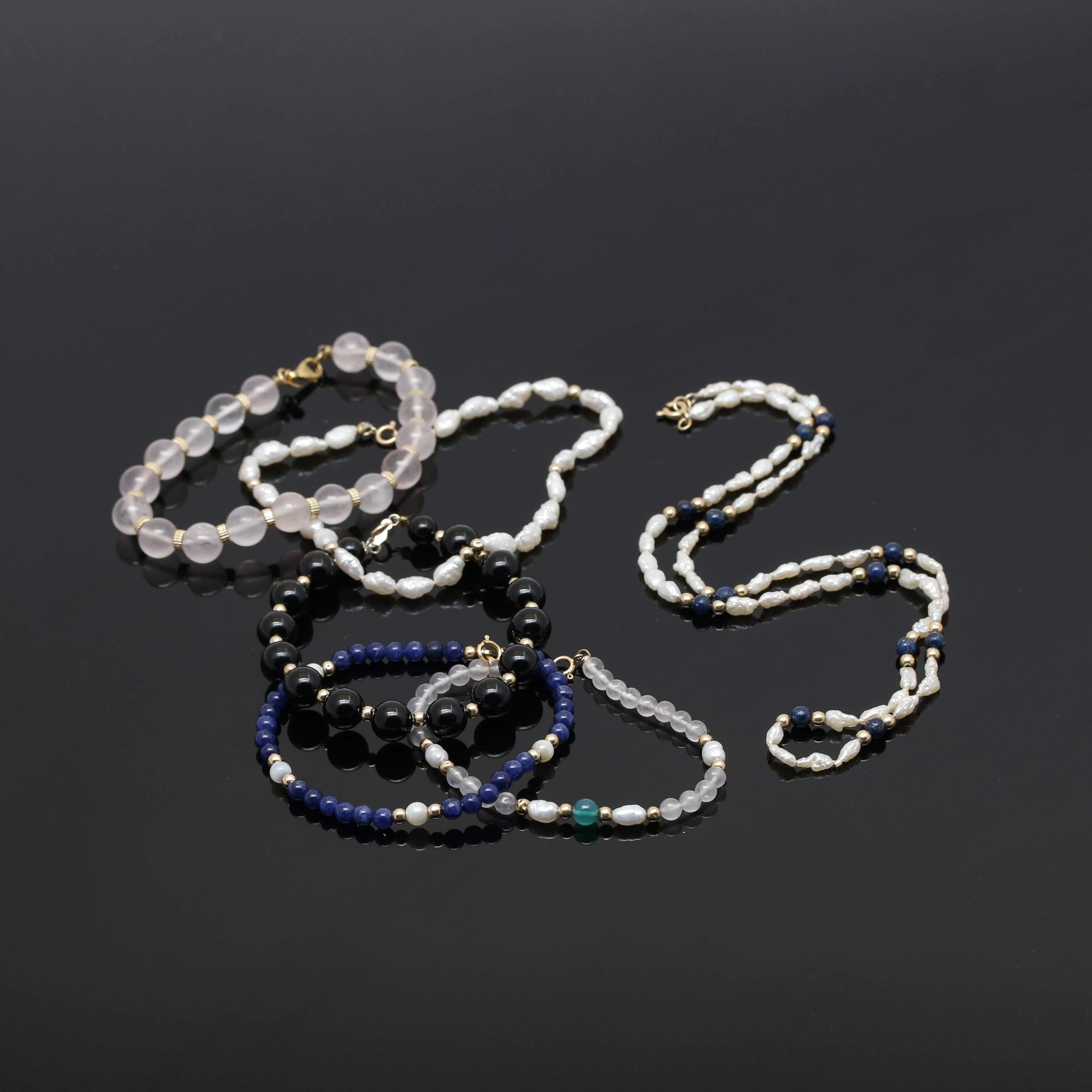 Assortment of 14K Yellow Gold Gemstone Bead Necklace and Bracelets.