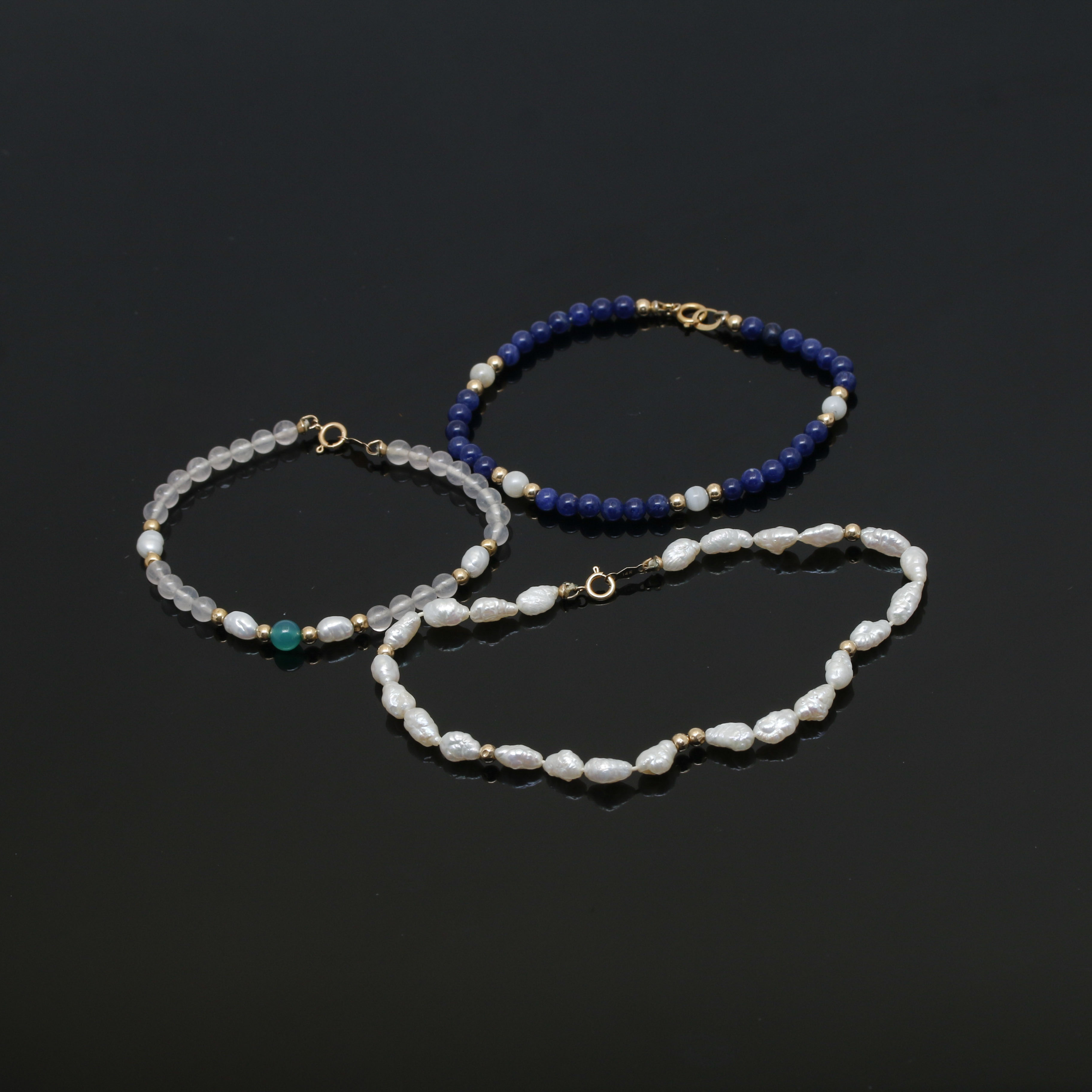 Assortment of 14K Yellow Gold Gemstone Bead Necklace and Bracelets.