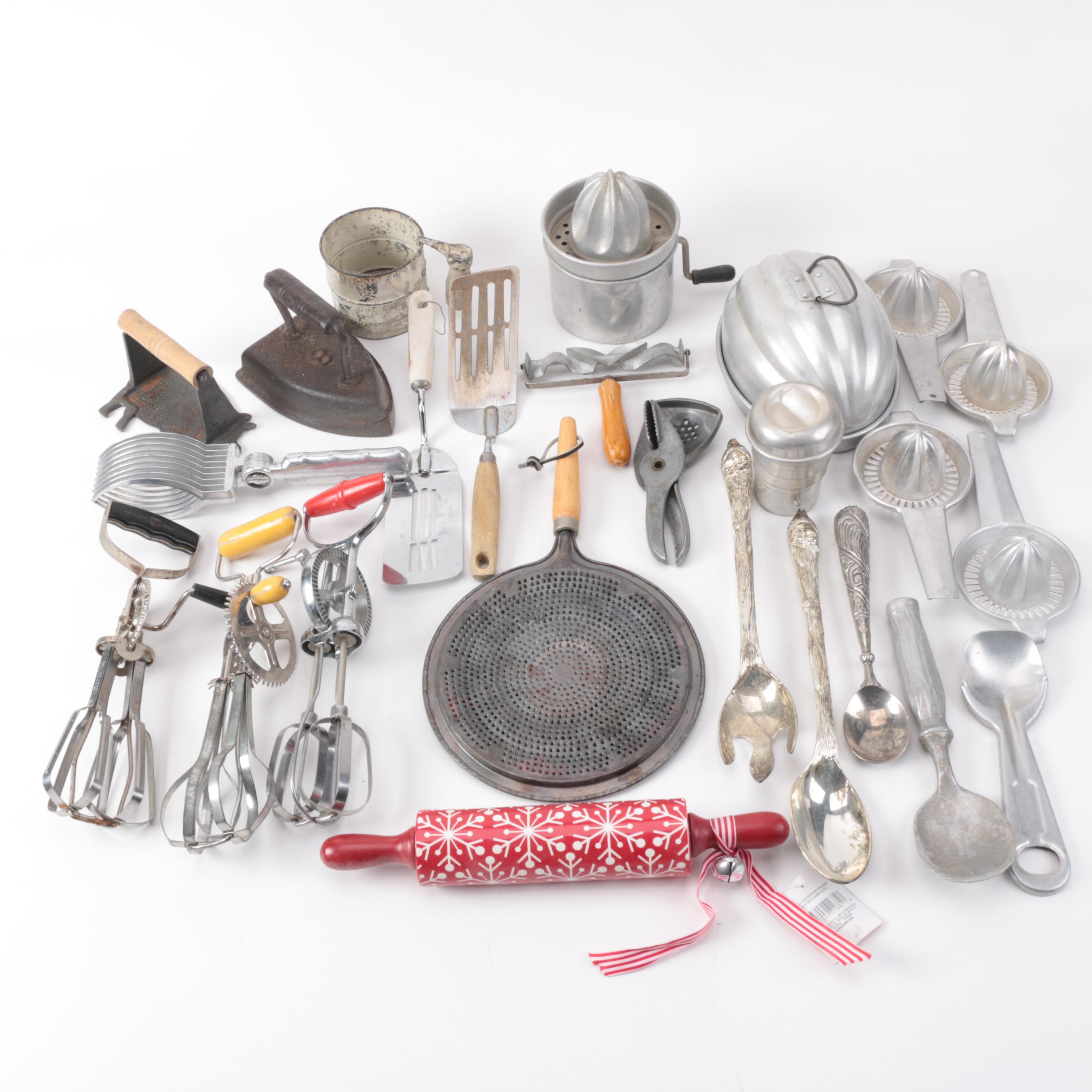 Vintage Kitchen Gadgets Featuring Hand Mixers, Serving Utensils and More