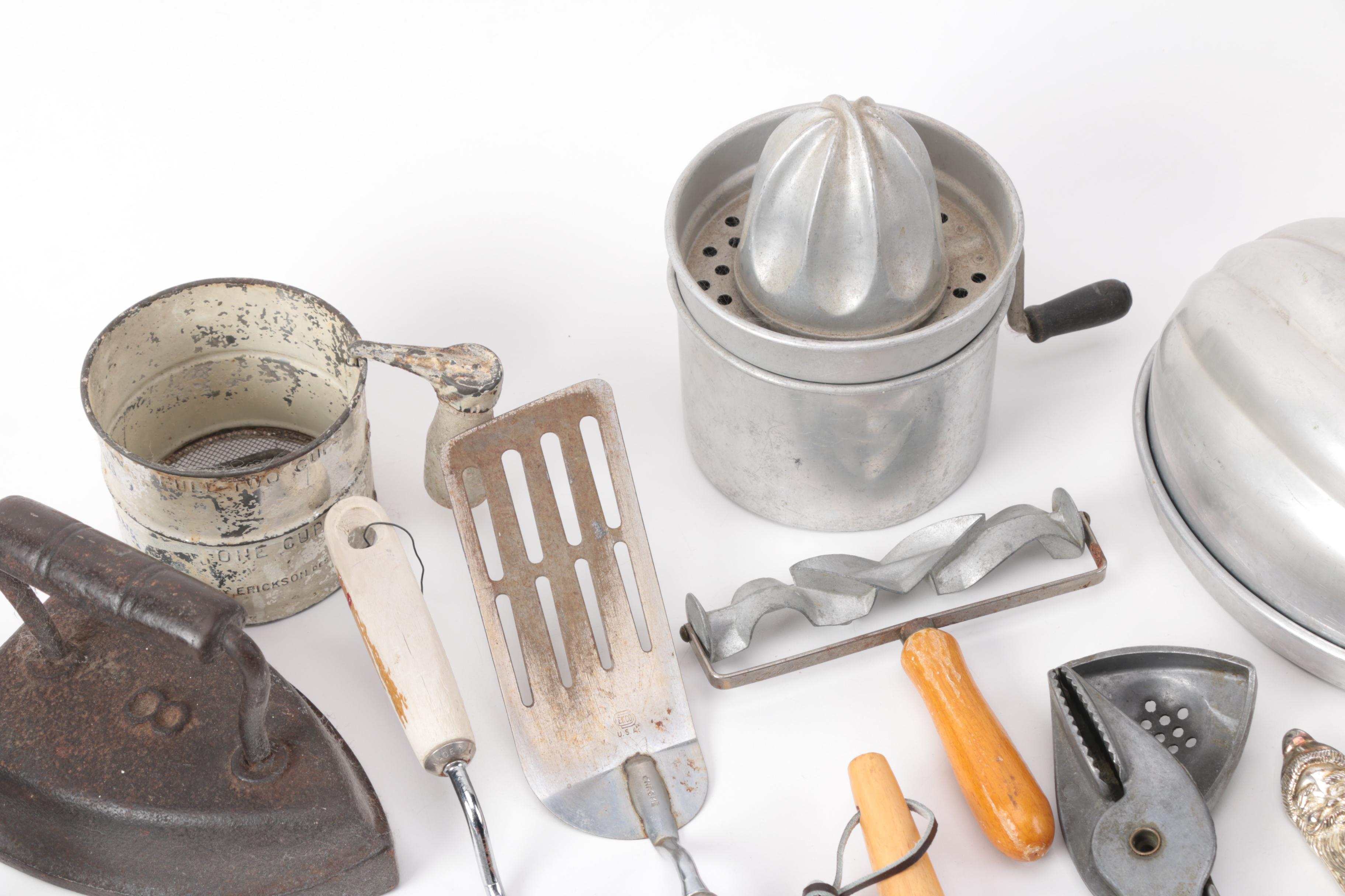 Vintage Kitchen Gadgets Featuring Hand Mixers, Serving Utensils and More