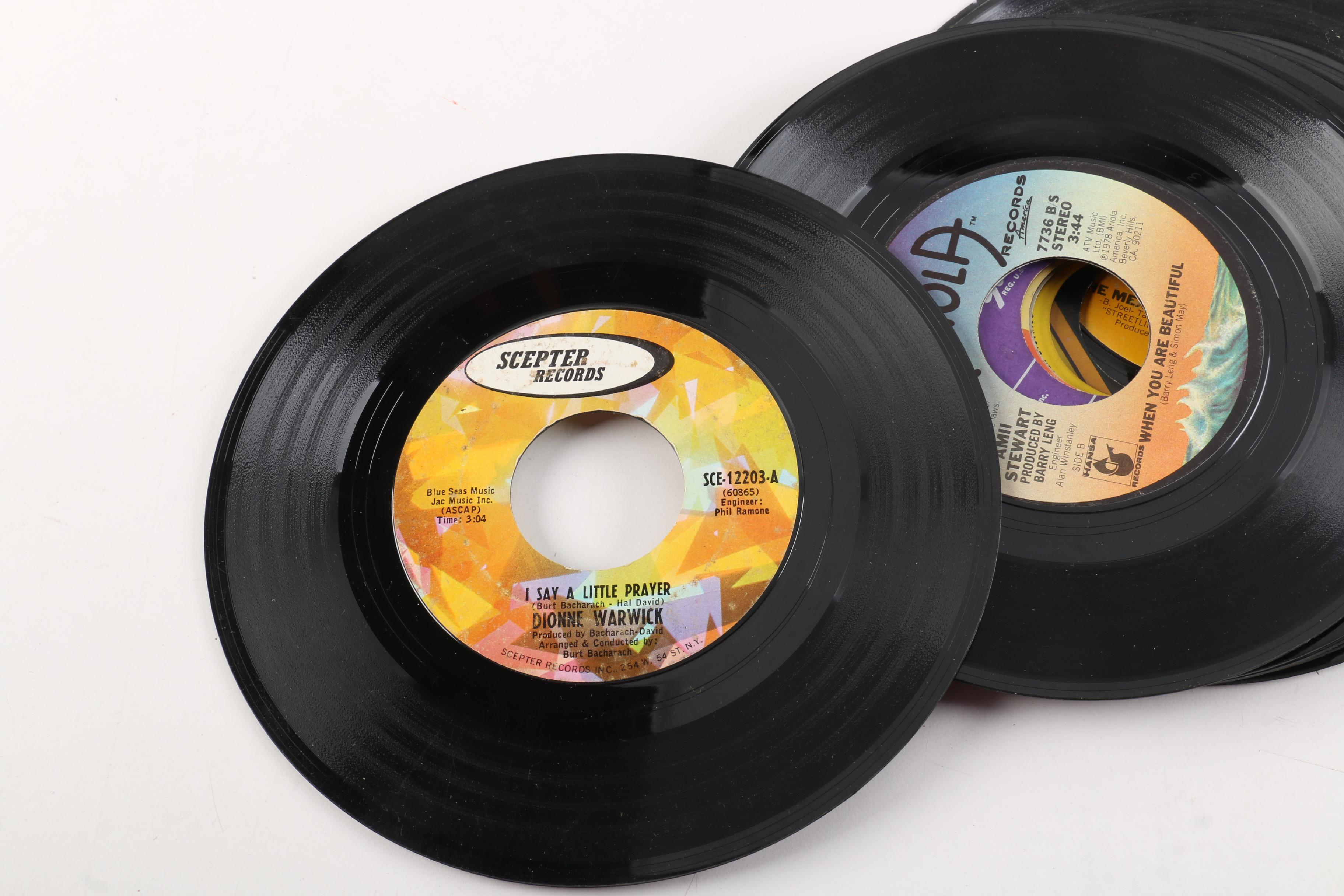 Vintage 45 RPM Records Including Dionne Warwick, Duran Duran, and Diana Ross