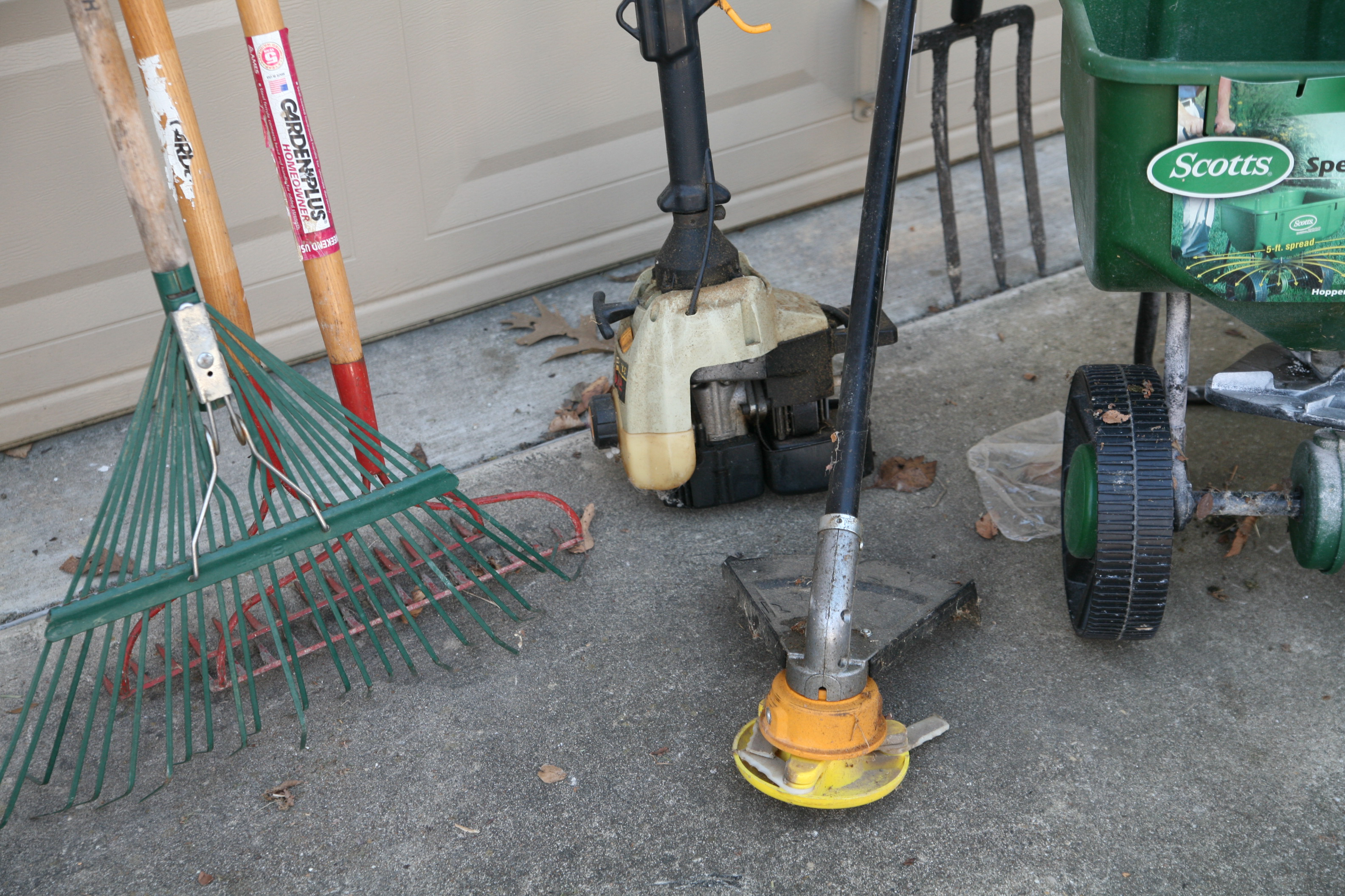 Landscaping Tools Including Trimmer, Rakes and Broadcast Spreader