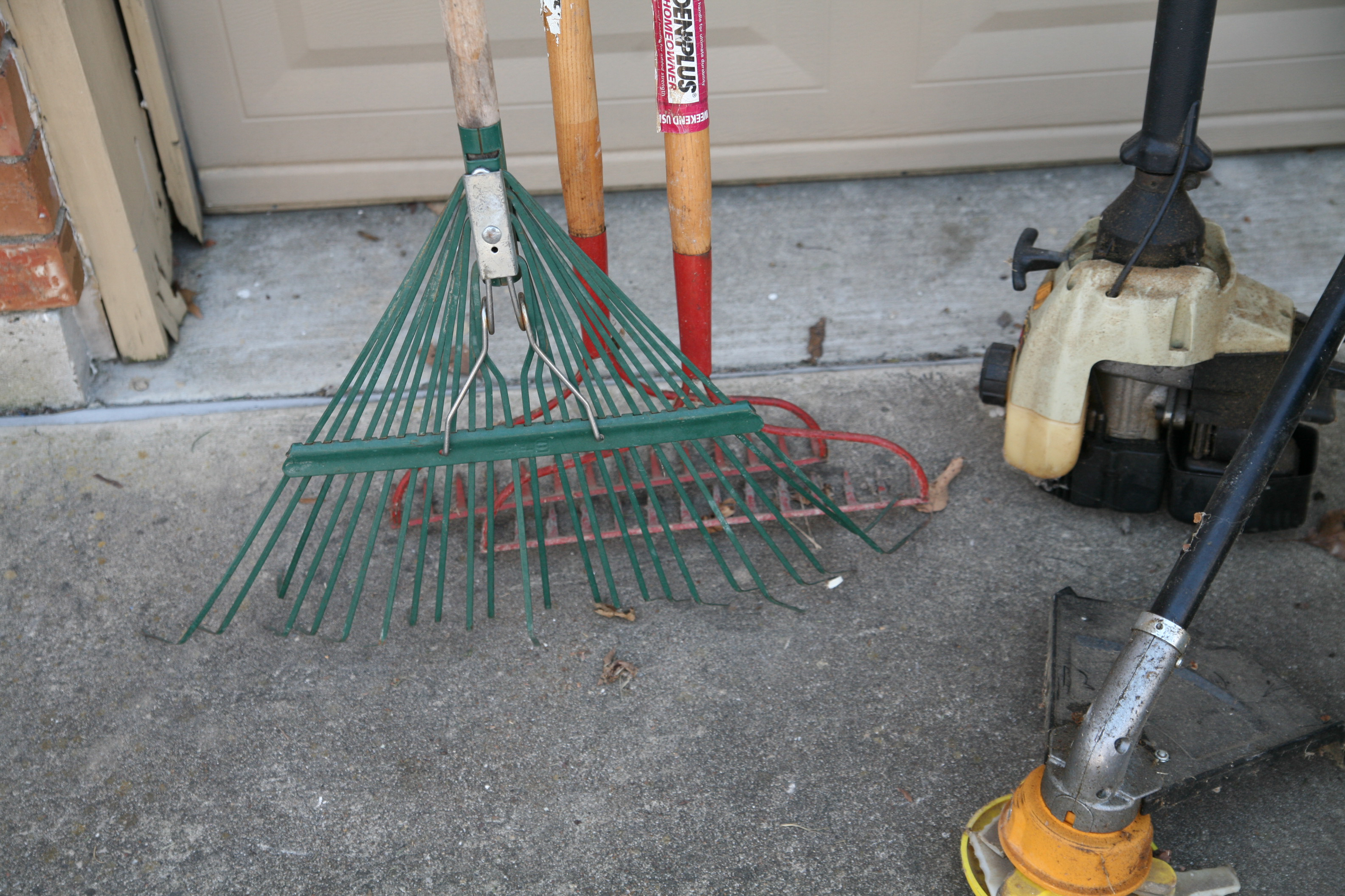 Landscaping Tools Including Trimmer, Rakes and Broadcast Spreader