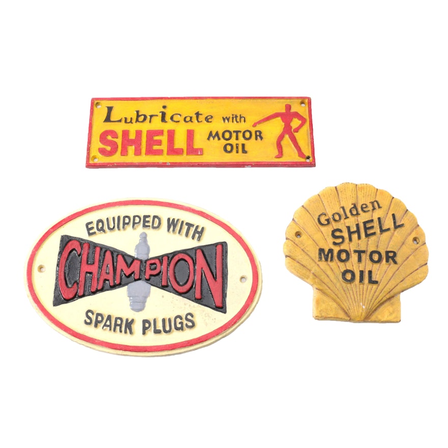 Cast Iron Signs for Shell Oil and Champion Spark Plugs